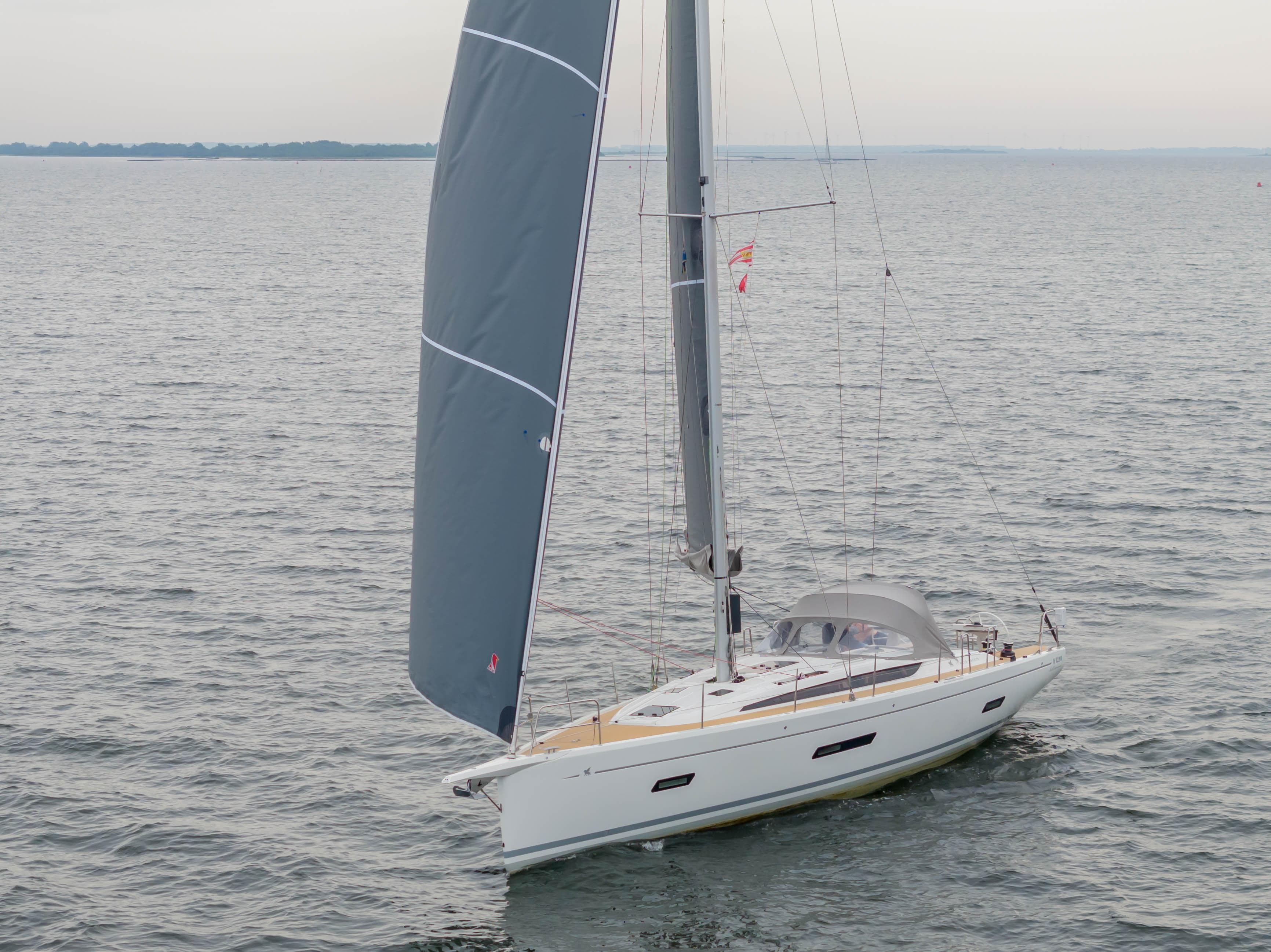 2023 Italia Yachts 12.98 sailing on open water, showcasing sleek design and modern features.
