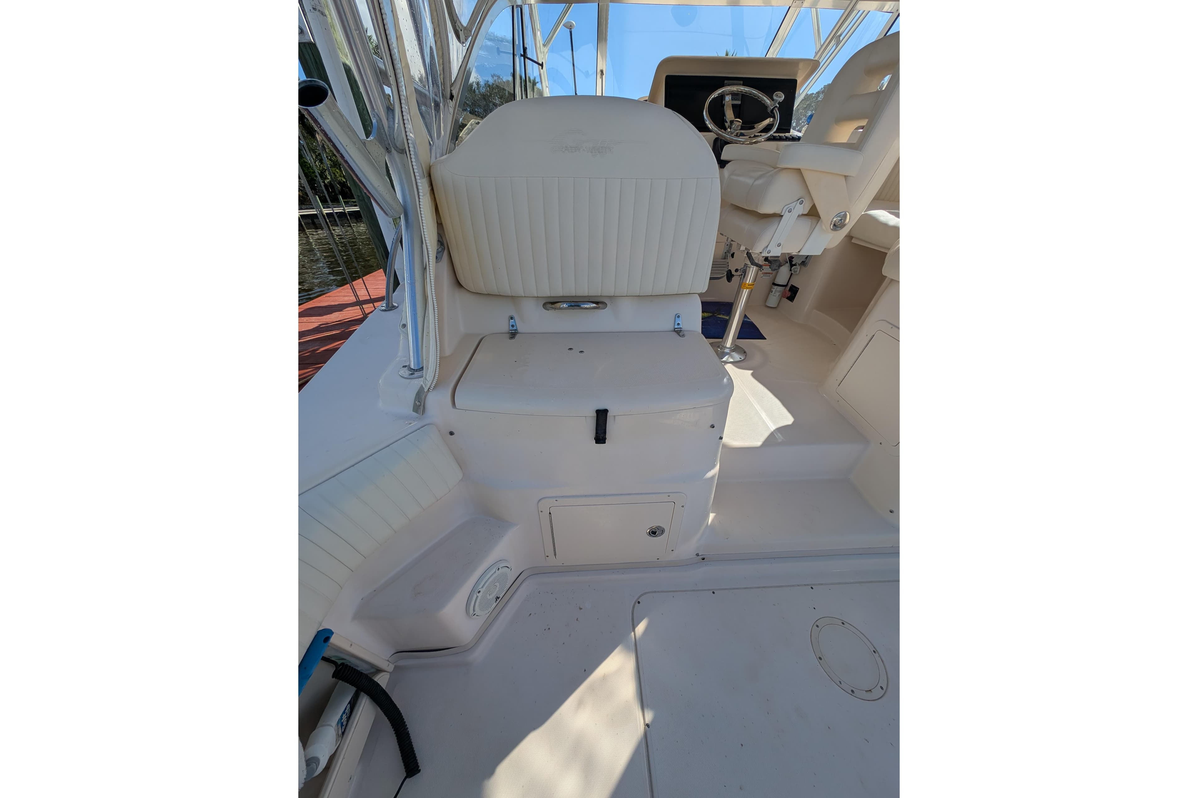 2010 Grady-White Express 330 boat interior with seating and steering wheel.