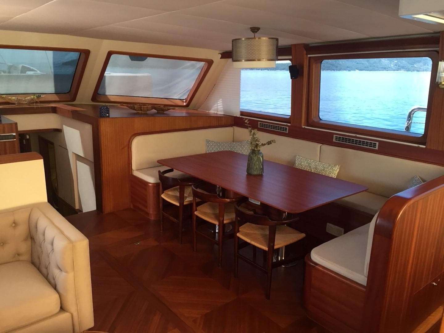 Luxurious interior of 2007 Custom 34m Steel Hull Gulet with elegant dining area and scenic windows.