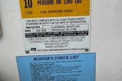 Capacity and safety labels on a 2002 Chaparral 200 SSe boat.