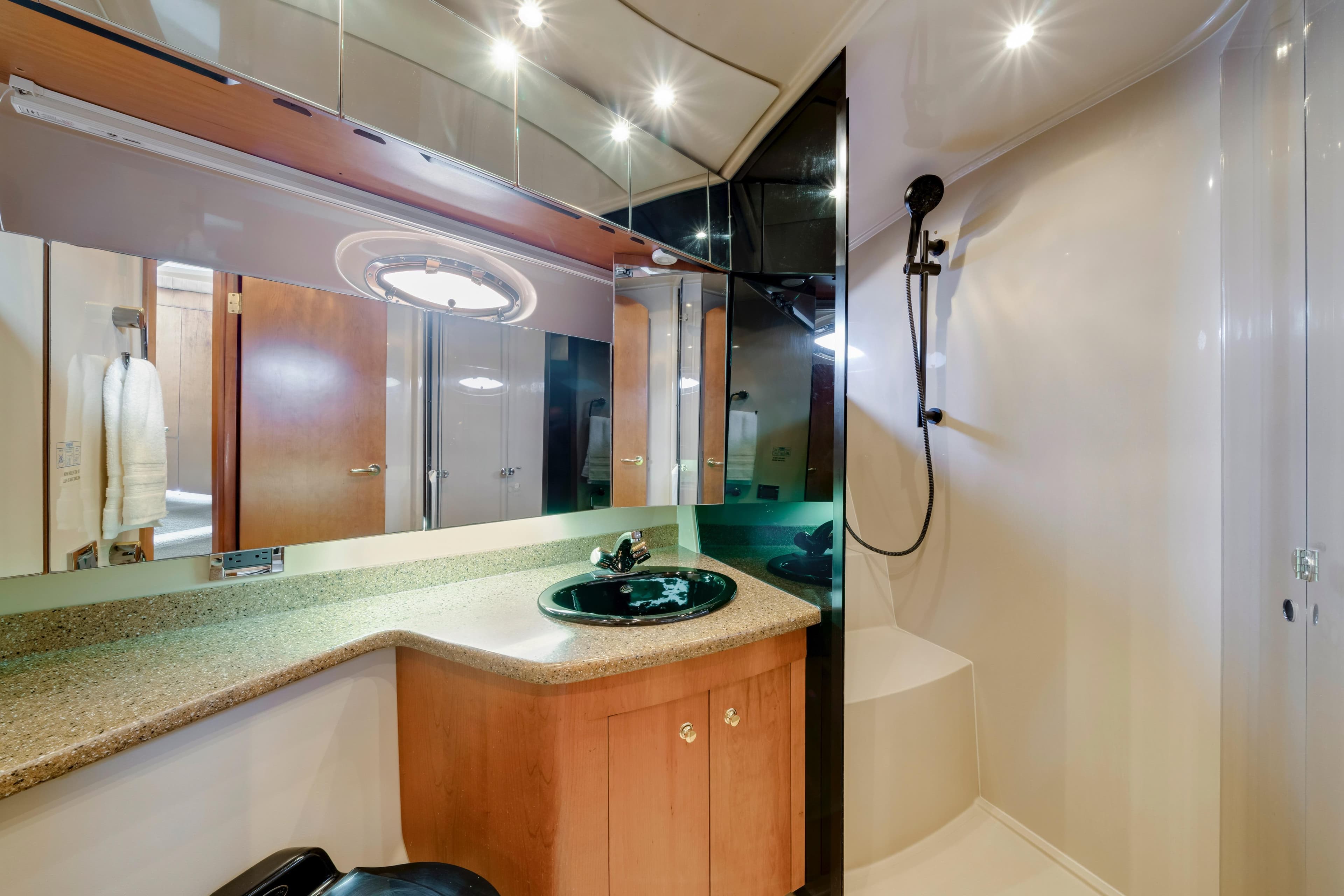 Luxurious bathroom in 2001 Cruisers Yachts 5000 Sedan Sport with modern fixtures.