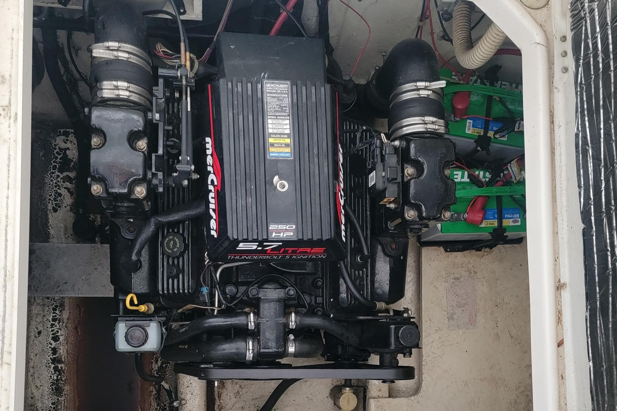 Engine compartment of a 1998 Bayliner 3255 Avanti with MerCruiser 5.7L engine.