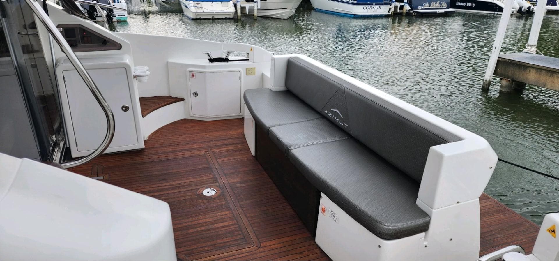 Azimut 45 Flybridge 2013 yacht with sleek seating, docked at a marina.
