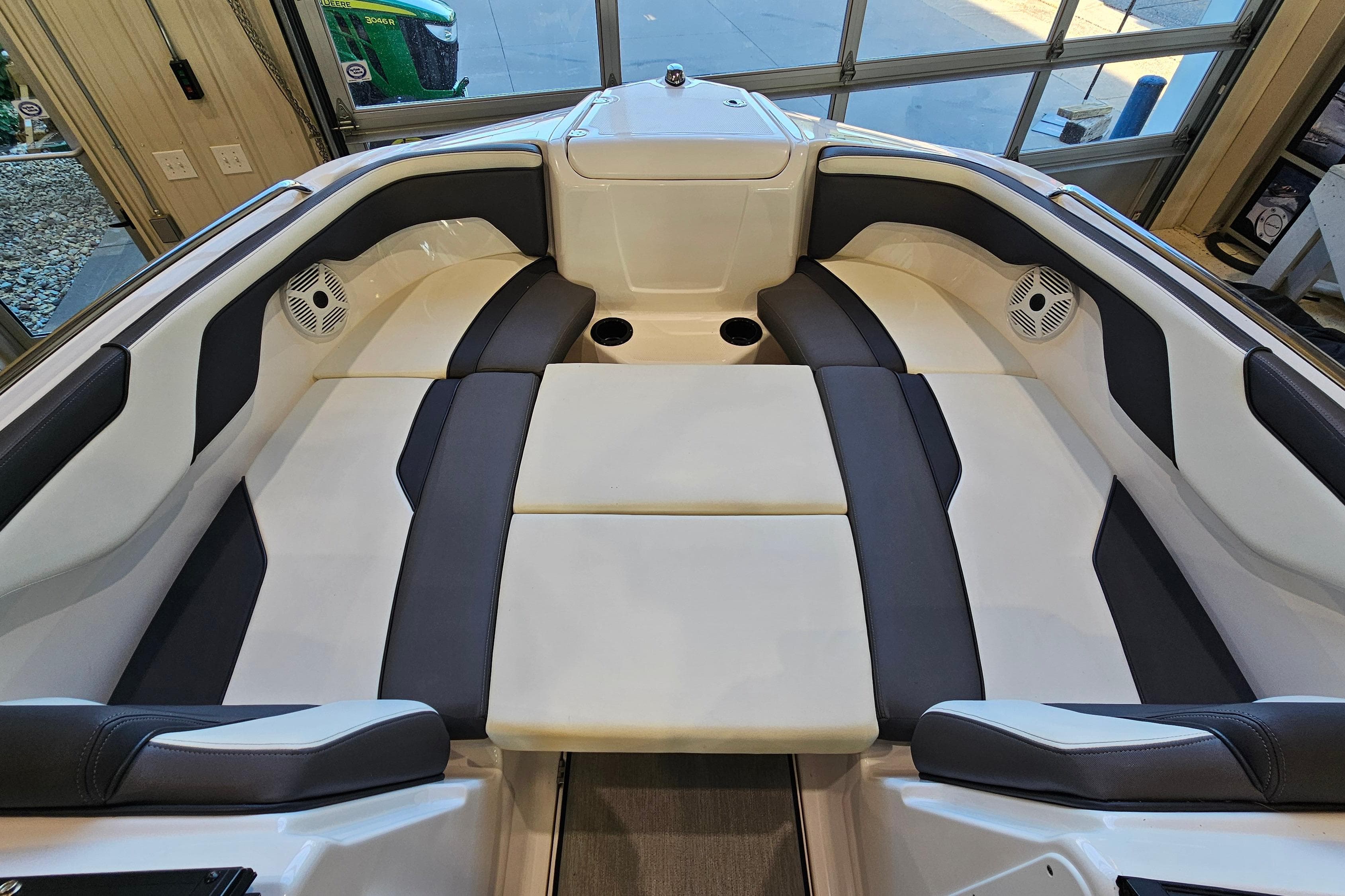 2022 Yamaha Boats SX210 interior with cushioned seating and speakers.