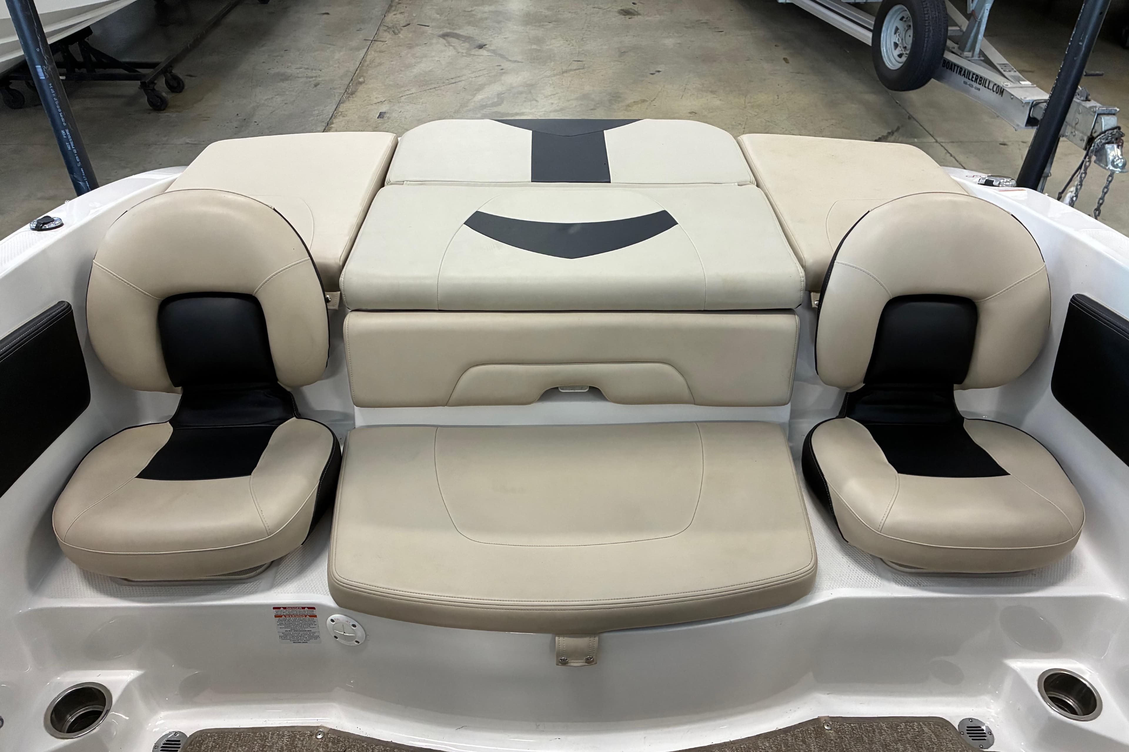 2017 Chaparral 21 H2O Ski & Fish boat interior with beige and black seating.