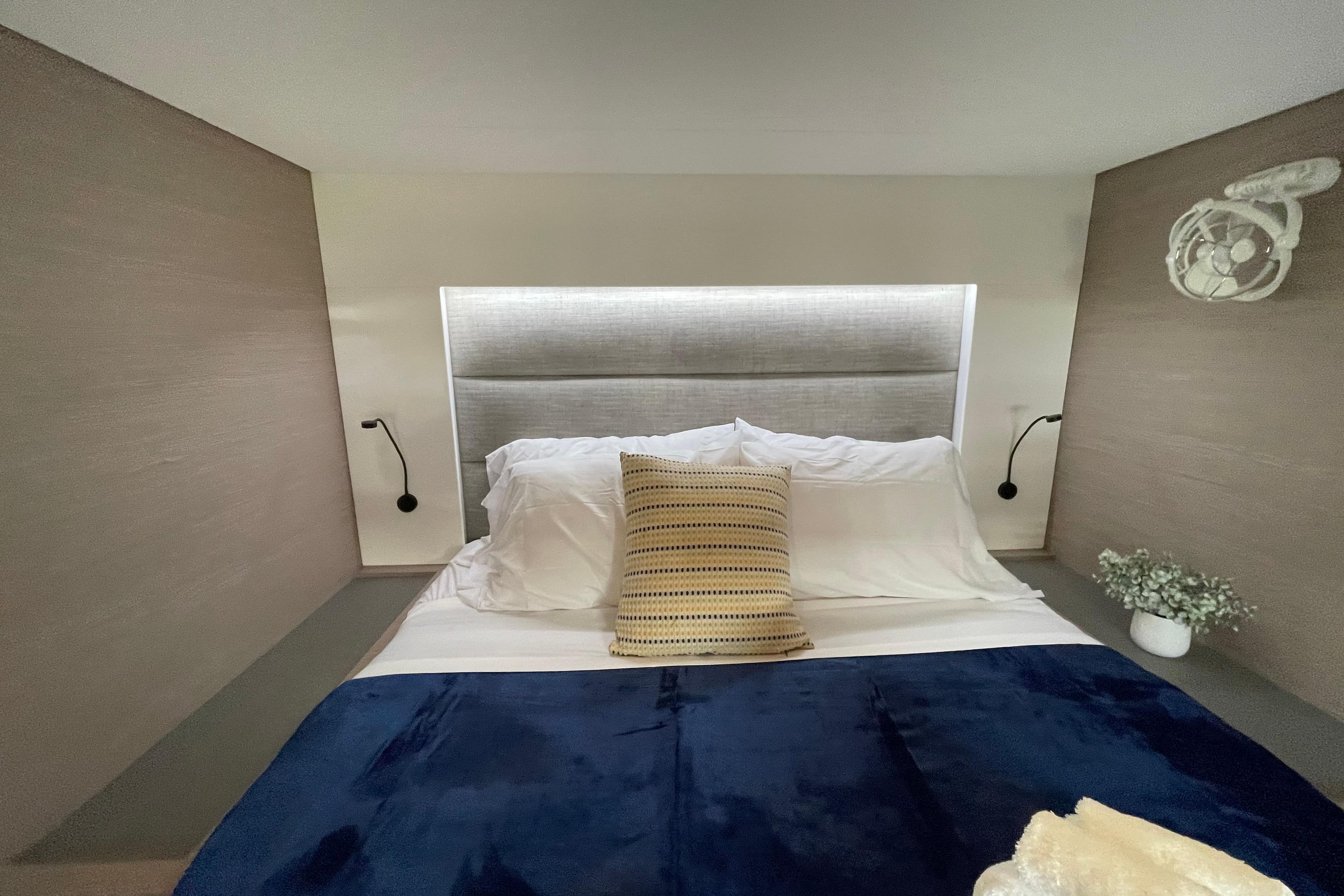 Luxurious bedroom interior of 2023 Fountaine Pajot Tanna 47 yacht with modern decor.