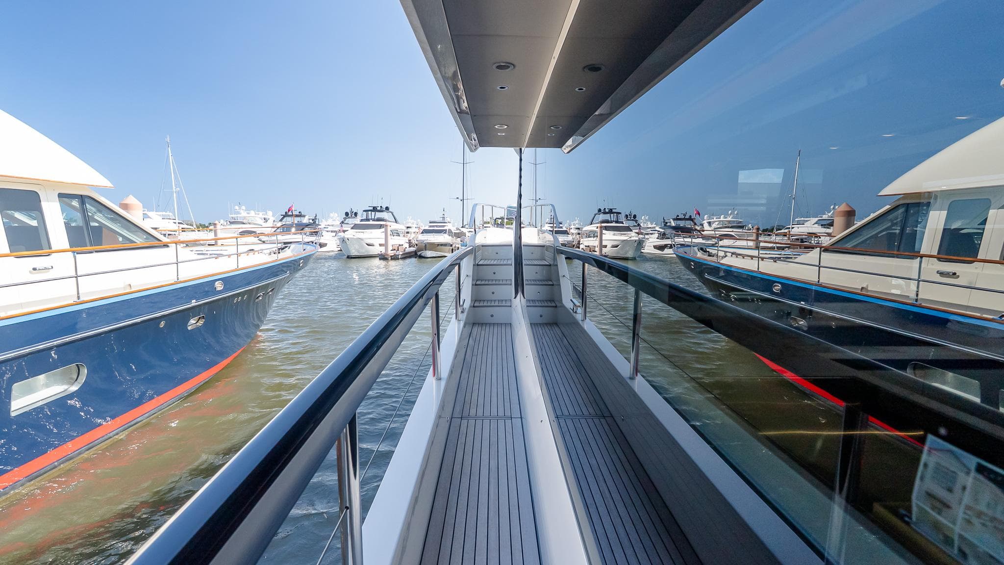 2024 Absolute 68 NAVETTA yacht docked, showcasing sleek design and luxurious features.