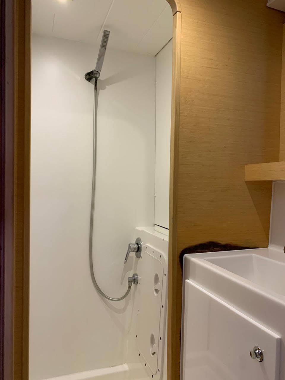 2017 Lagoon 42 yacht bathroom with shower and sink.