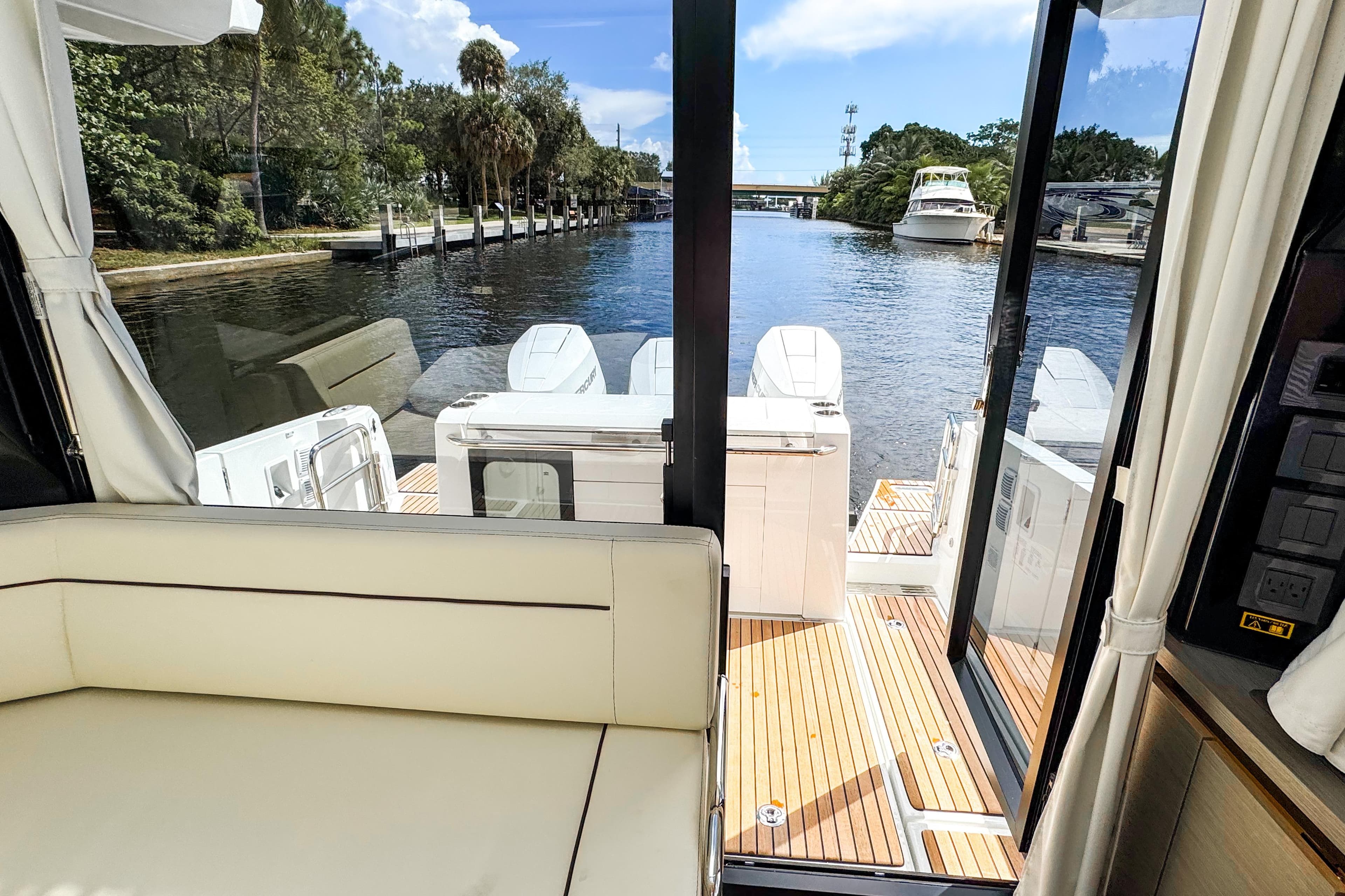 Interior view of 2025 Wellcraft 38 Explorer yacht with scenic waterway.