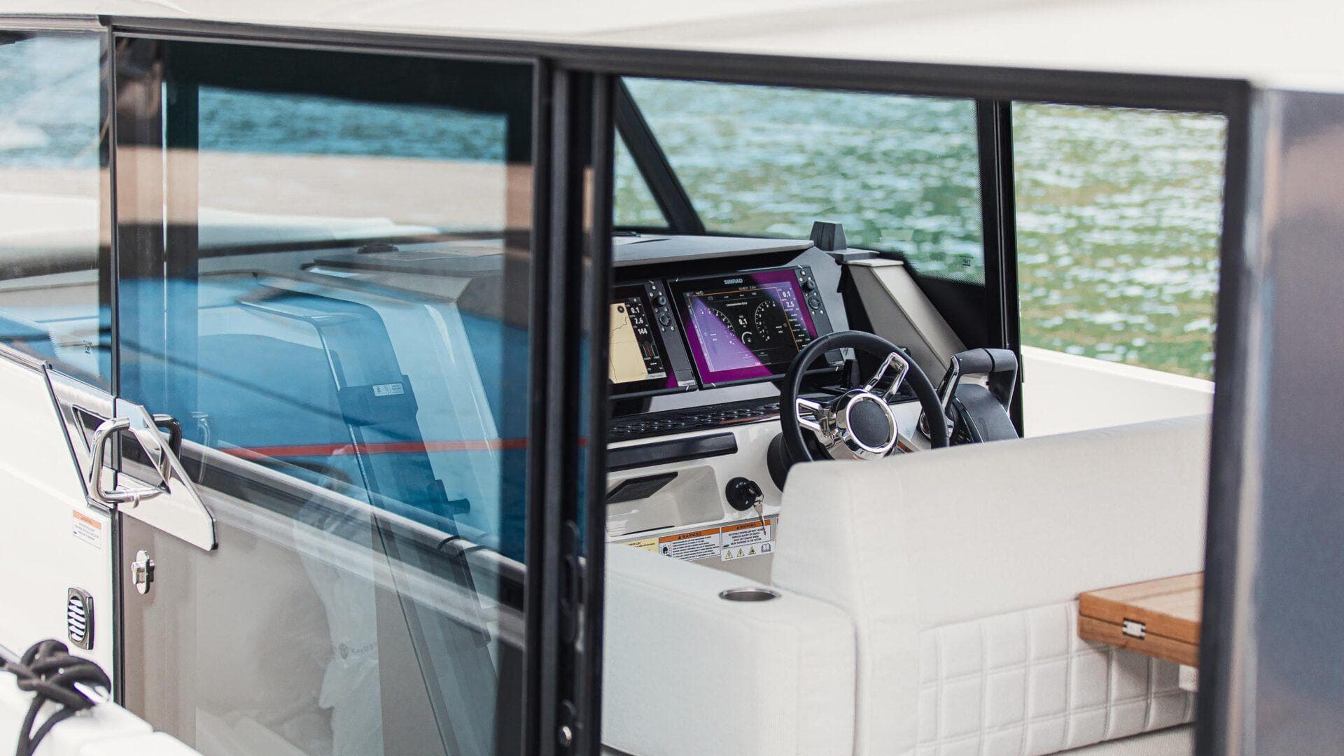 Interior view of 2025 Saxdor 340 GTWA boat cockpit with modern navigation system.