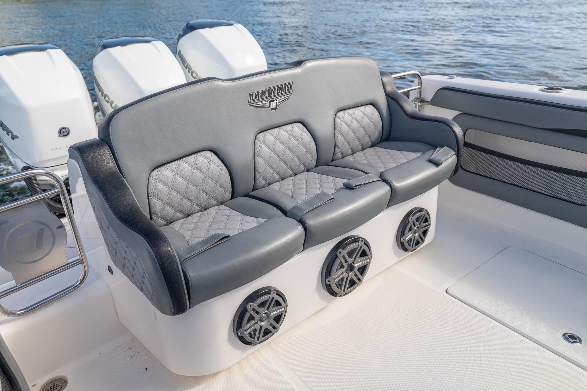 Luxury seating on 2019 Deep Impact 369 Sport boat with stylish design and speakers.