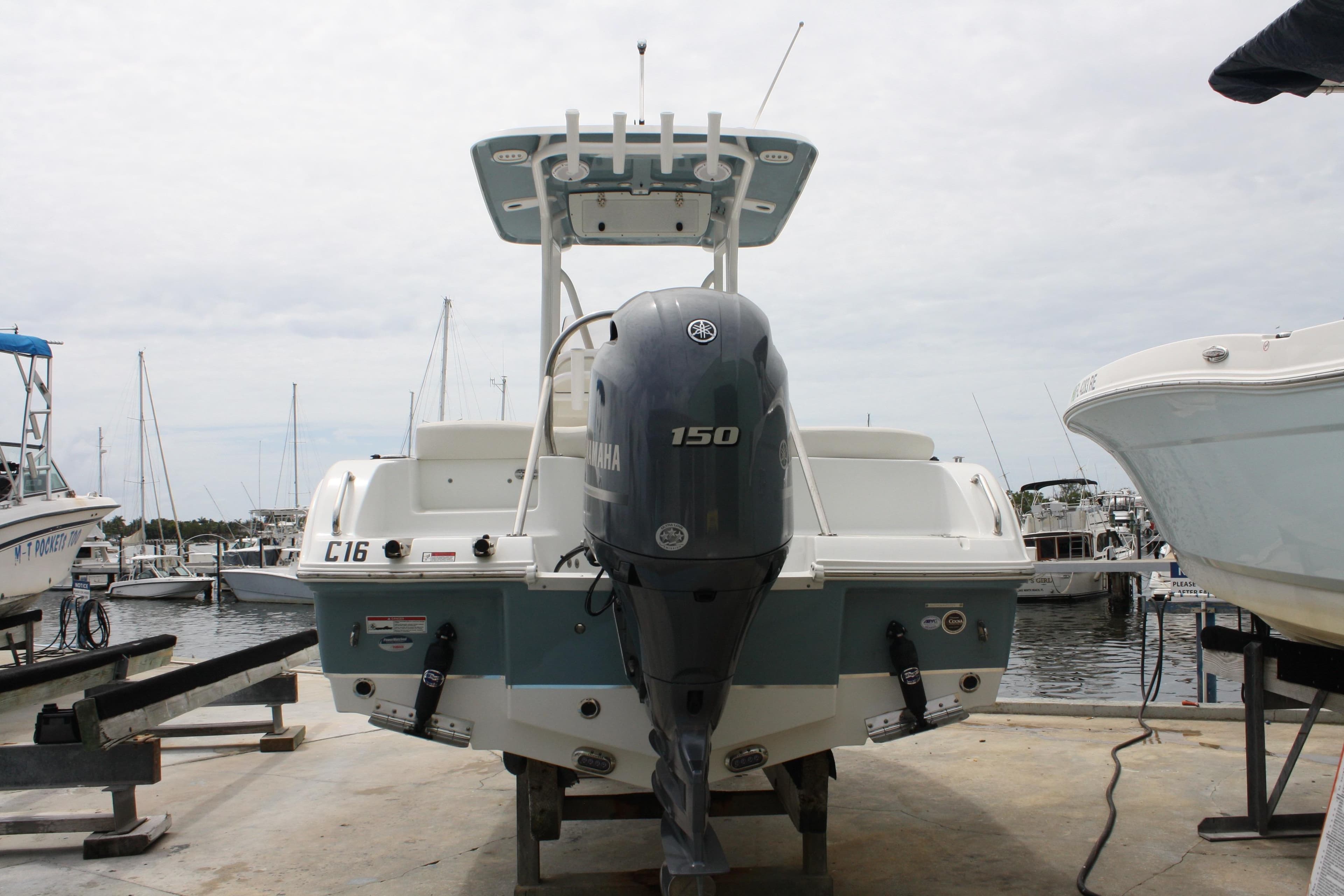 2022 Sea Hunt Ultra 219 boat with Yamaha 150 engine at marina dock.