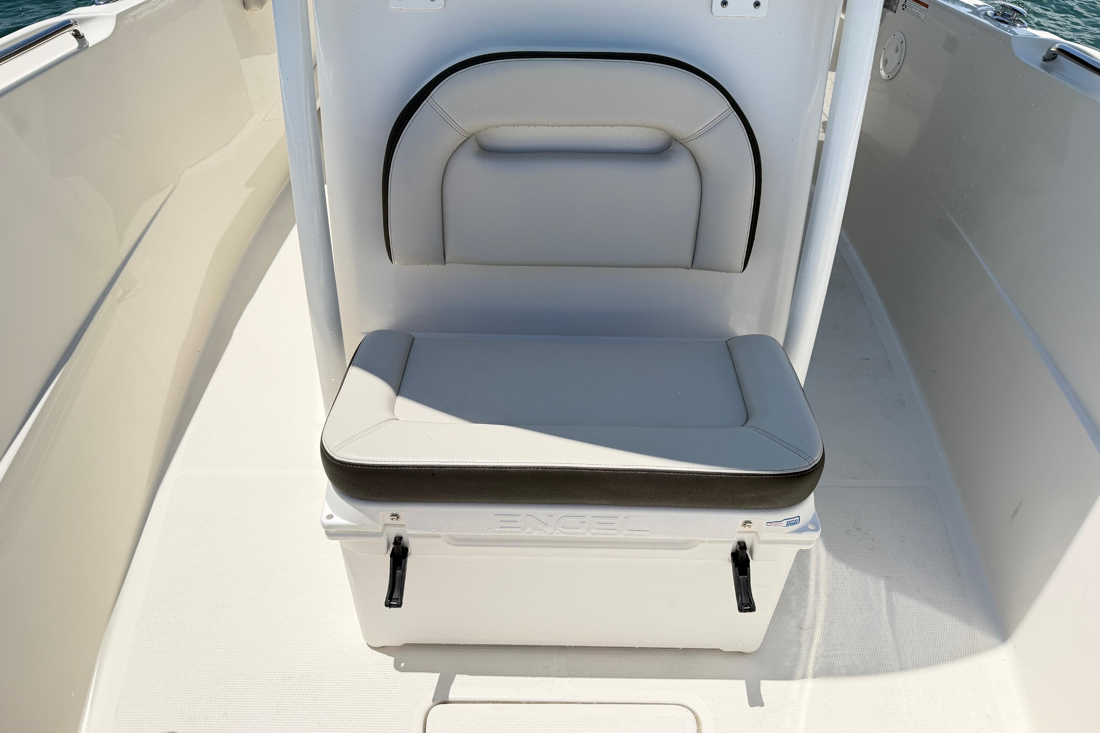 2021 Sailfish 290 CC boat seat with integrated cooler on deck.