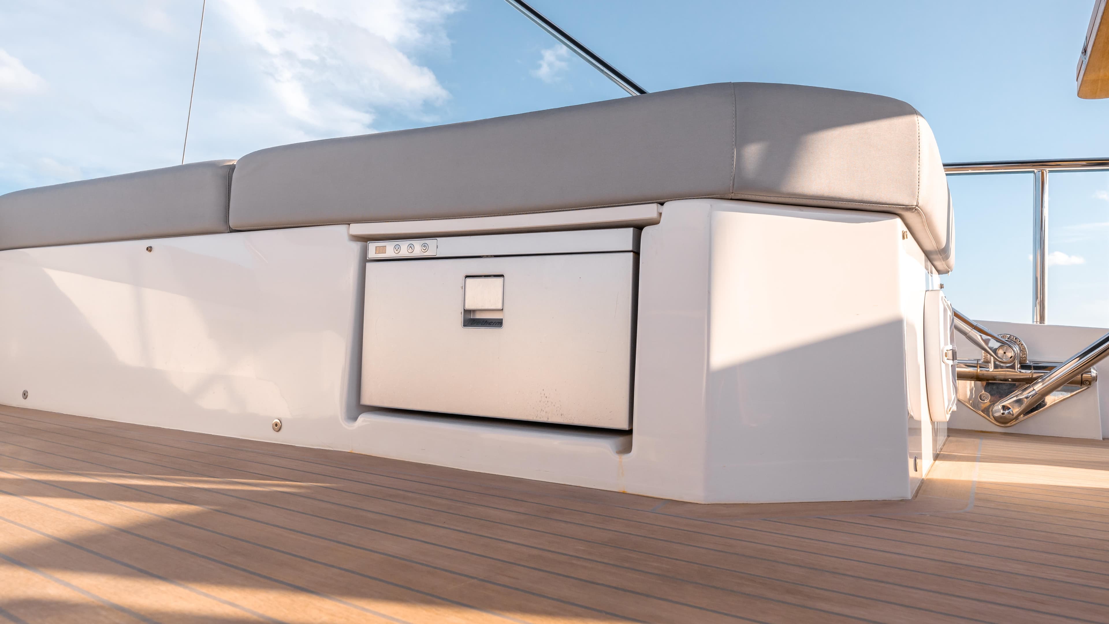 2024 Pardo Yachts E60 deck with cushioned seating and storage compartment.