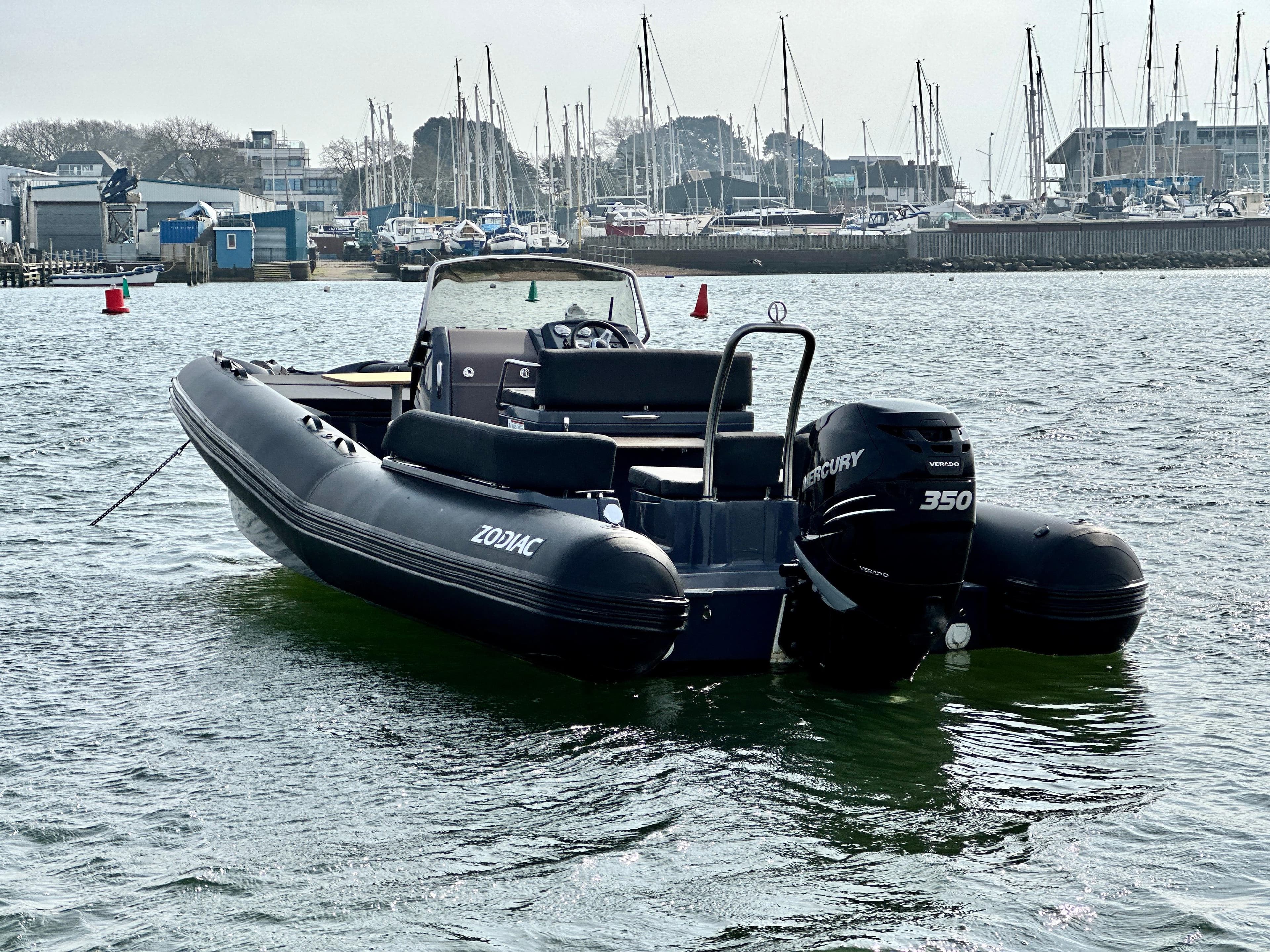 2021 Zodiac N-ZO 760 boat with Mercury 350 engine in marina setting.