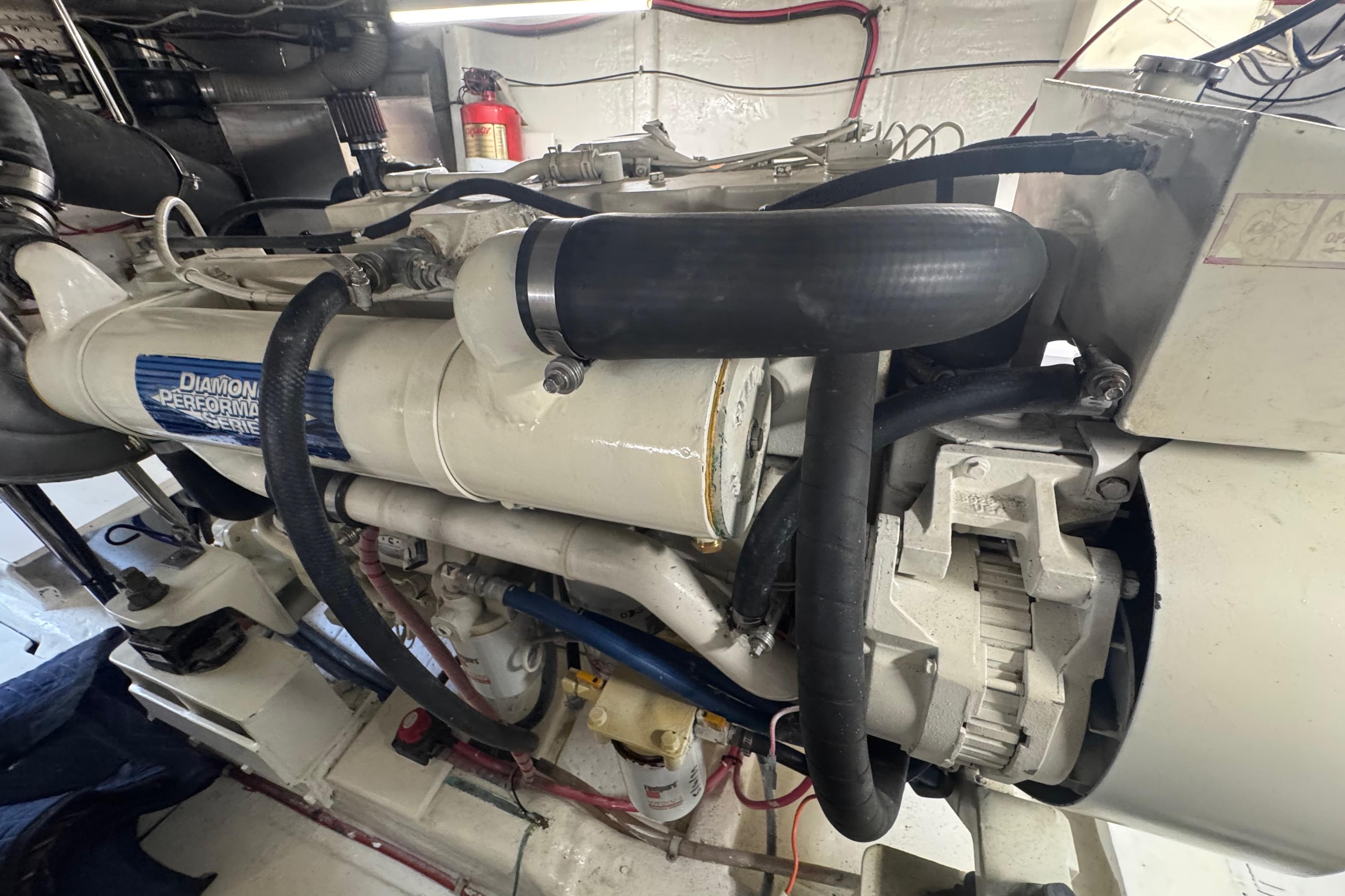 Engine room of a 2002 Hampton 550 yacht, featuring a Diamond Performance Series engine.