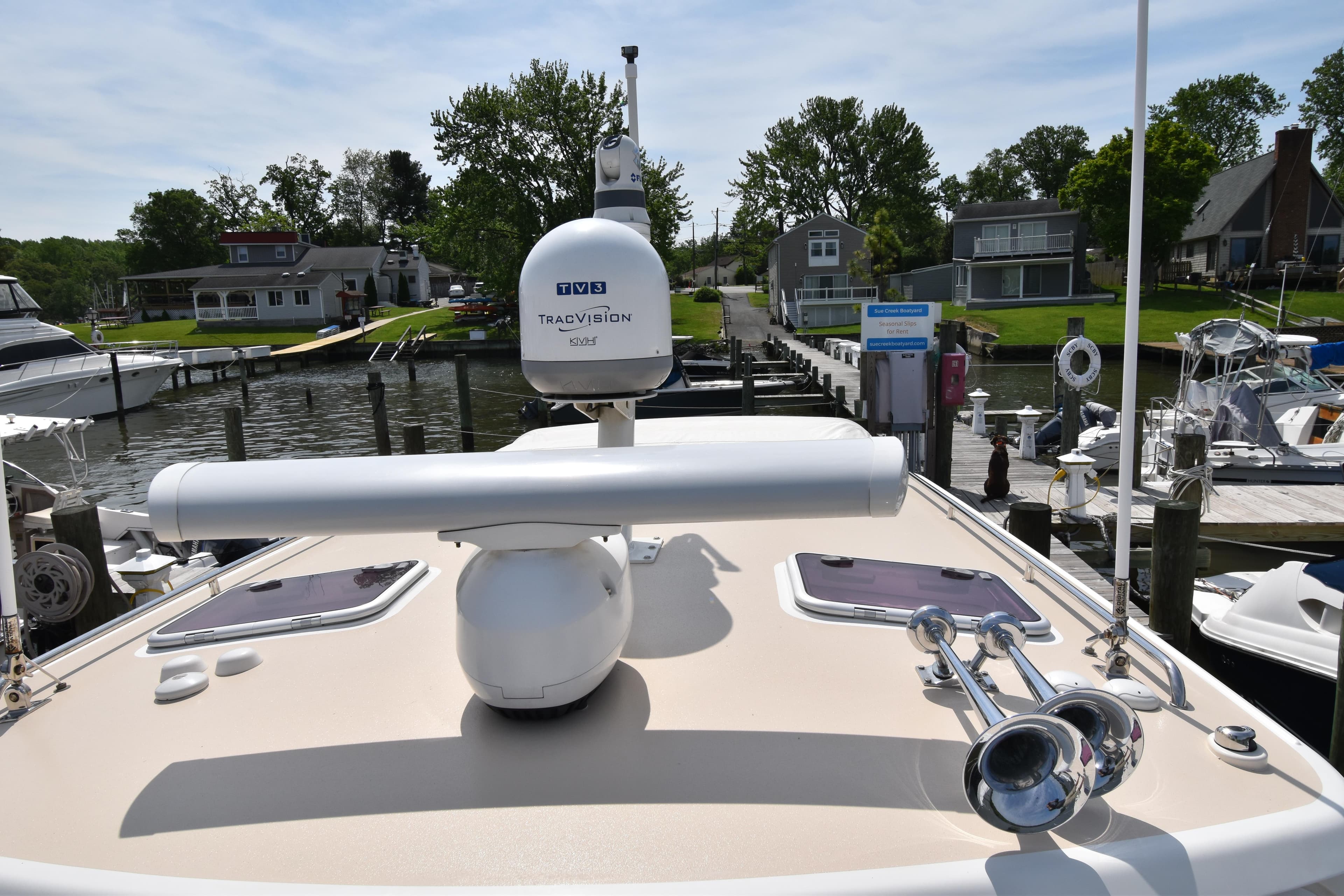 2011 MJM 40z Downeast boat docked at a marina with radar and horn.