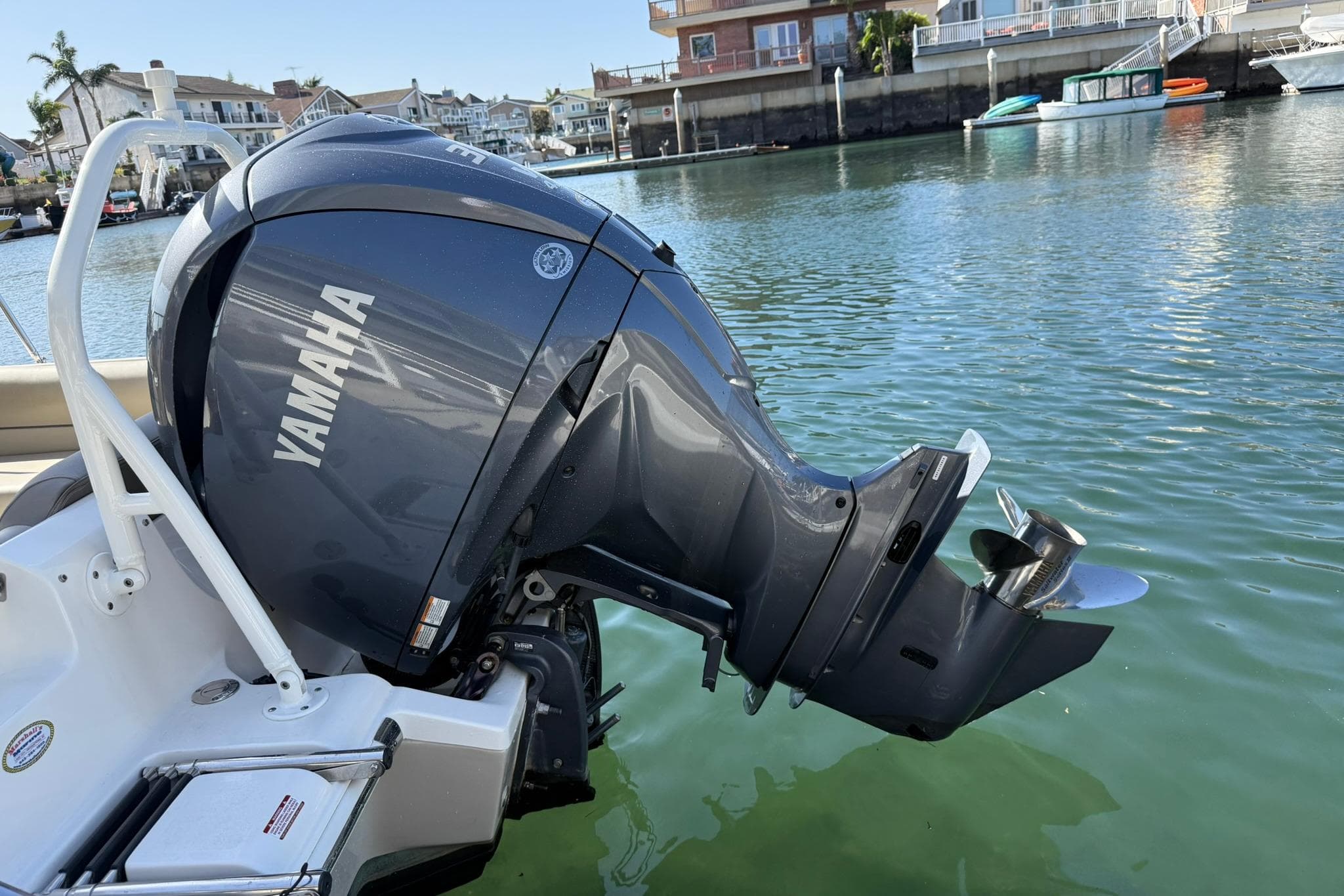 2023 Key West 239 DFS with Yamaha outboard motor on calm water.