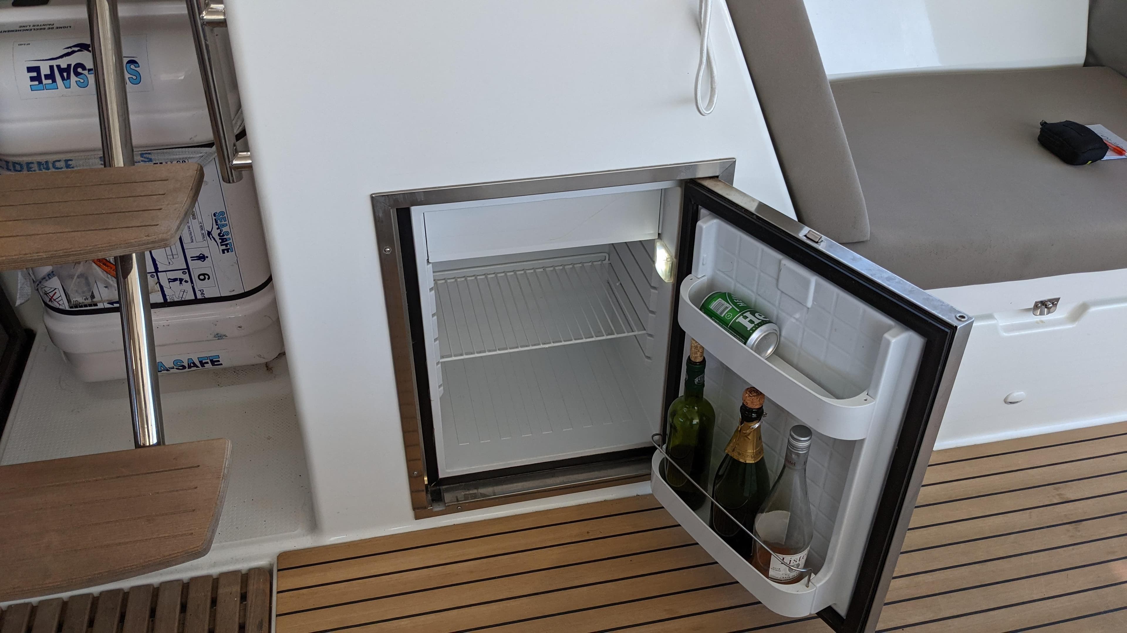 Mini fridge on 2019 Fountaine Pajot Saona 47 yacht with drinks inside.