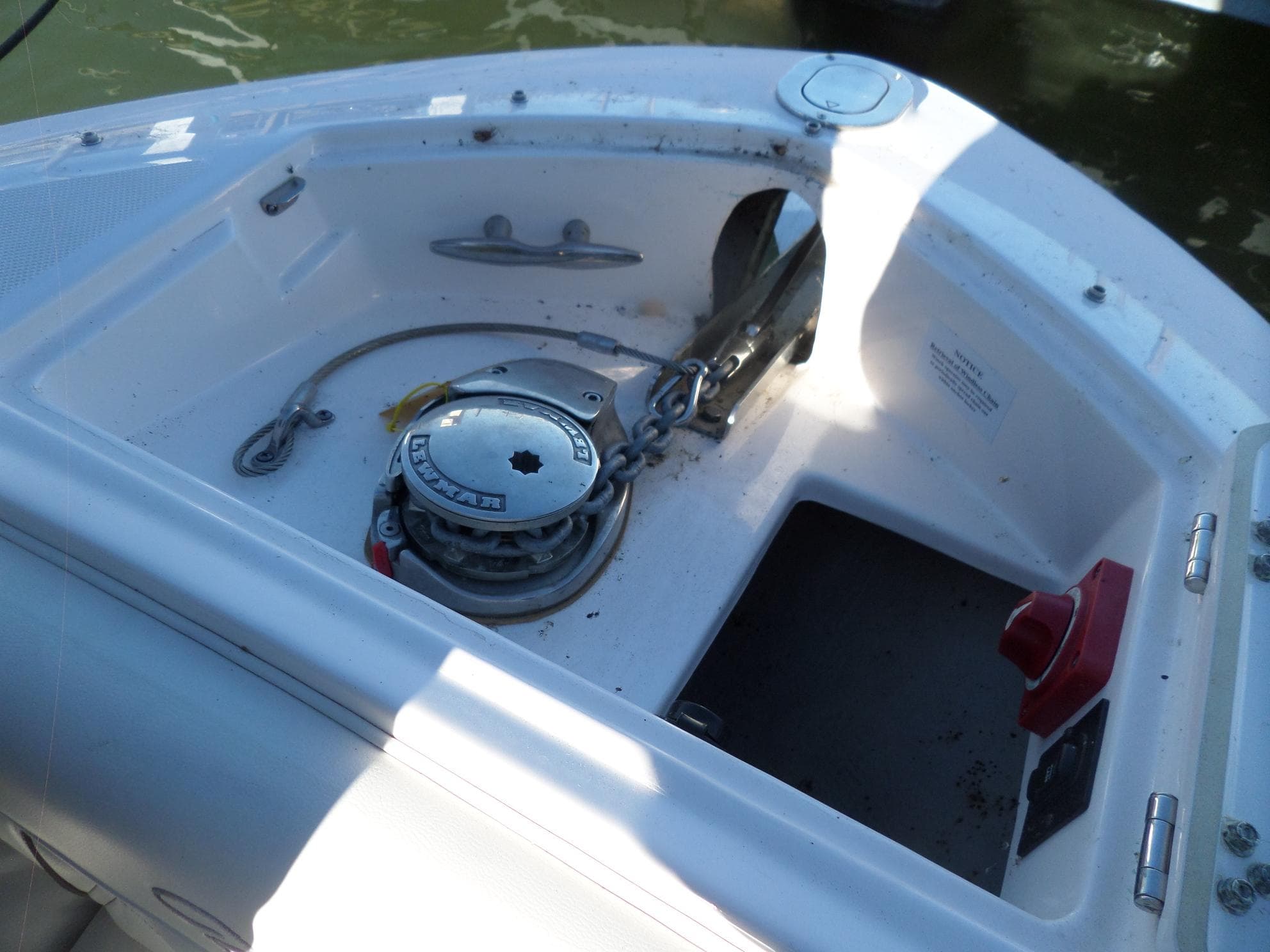 2020 Regal LS6 boat anchor compartment with winch and chain.
