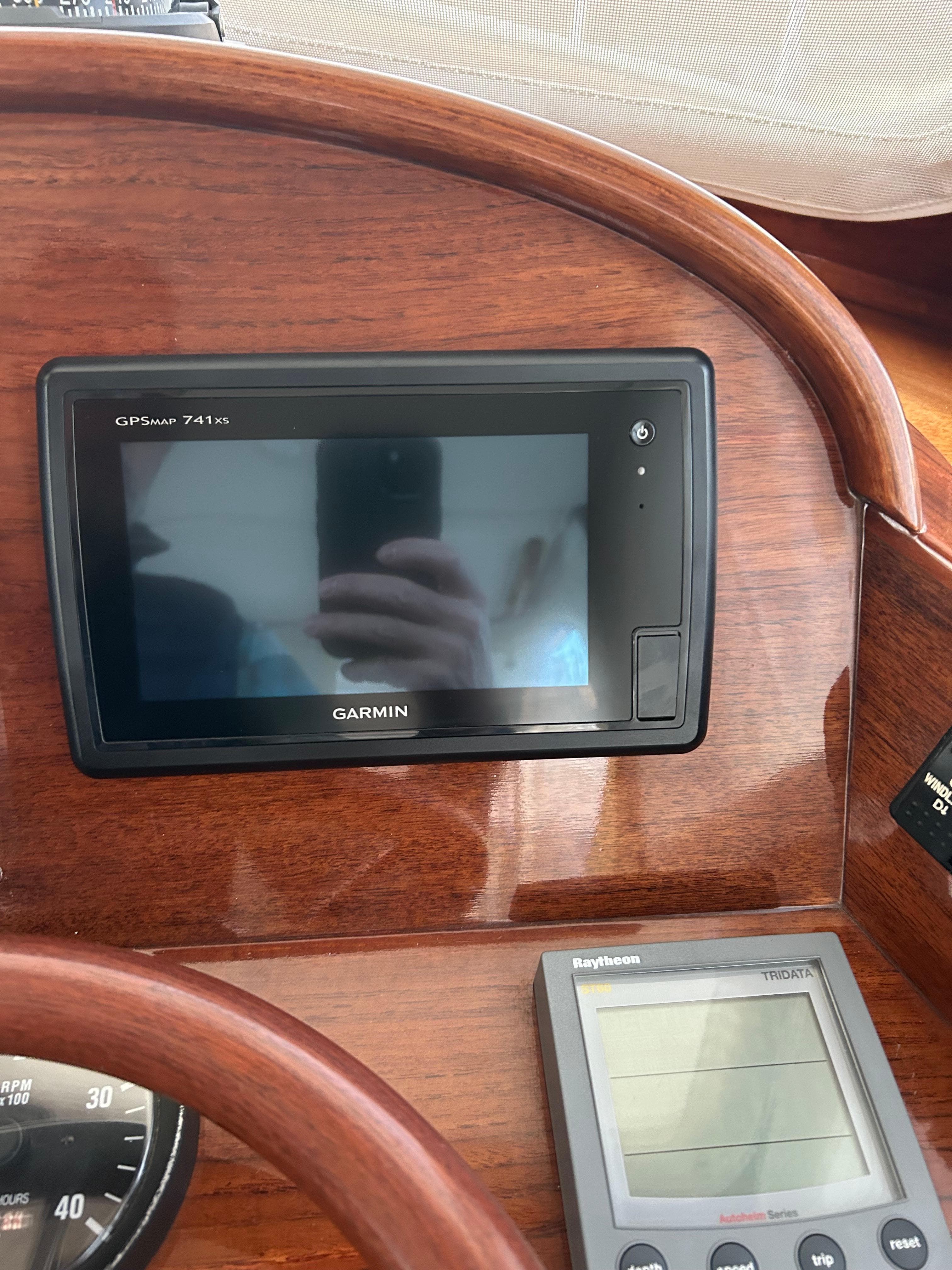 Garmin GPS and Raytheon display on 2001 Hinckley Classic 36 Picnic Boat dashboard.