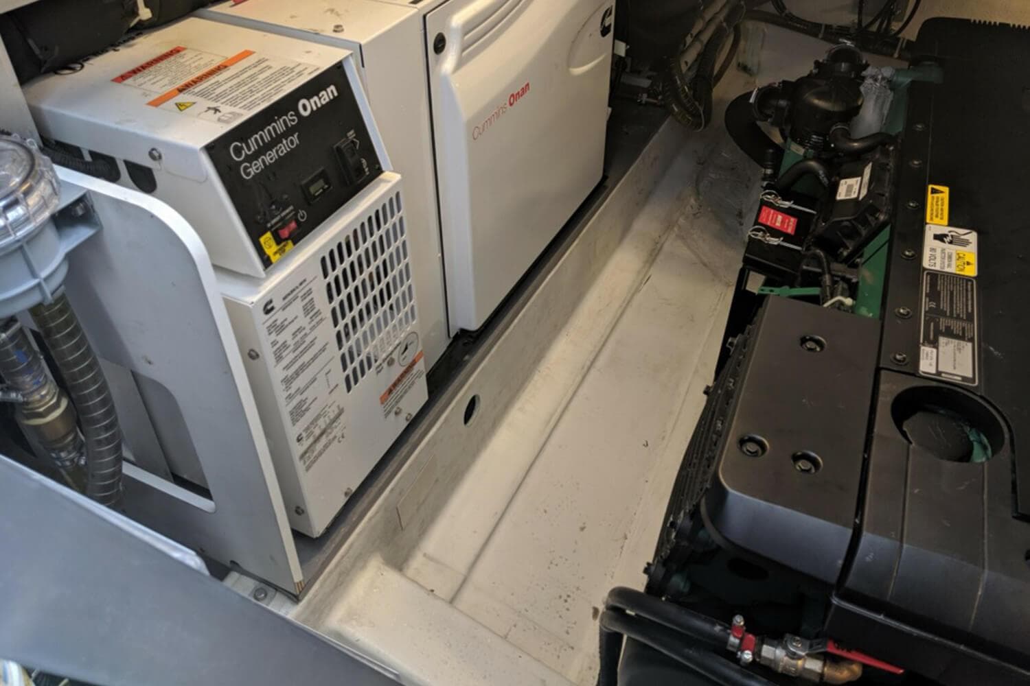 Engine room of 2017 Beneteau Gran Turismo with Cummins Onan generator and Volvo Penta engine.