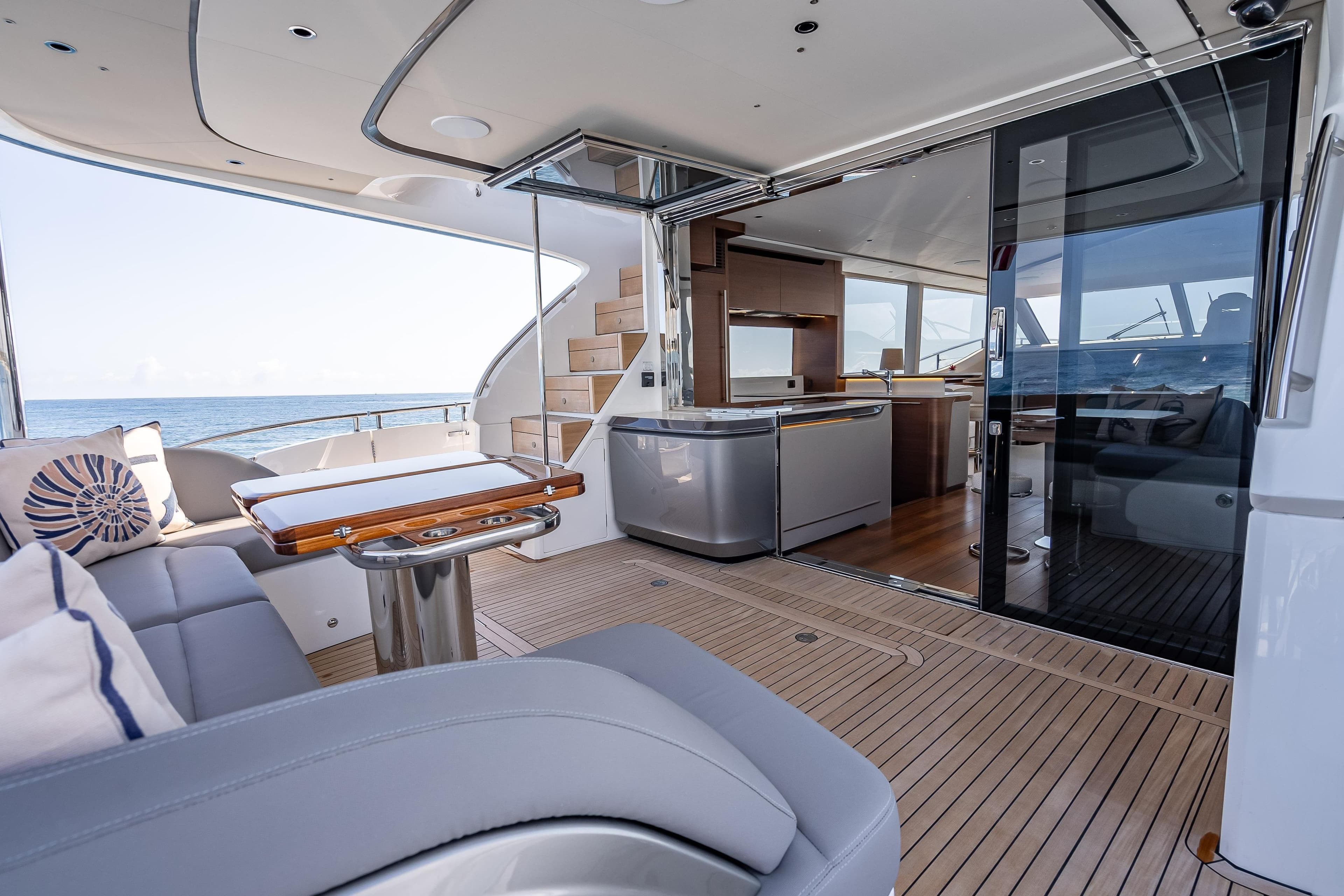 Luxurious 2023 Princess Y72 yacht interior with elegant seating and modern kitchen.
