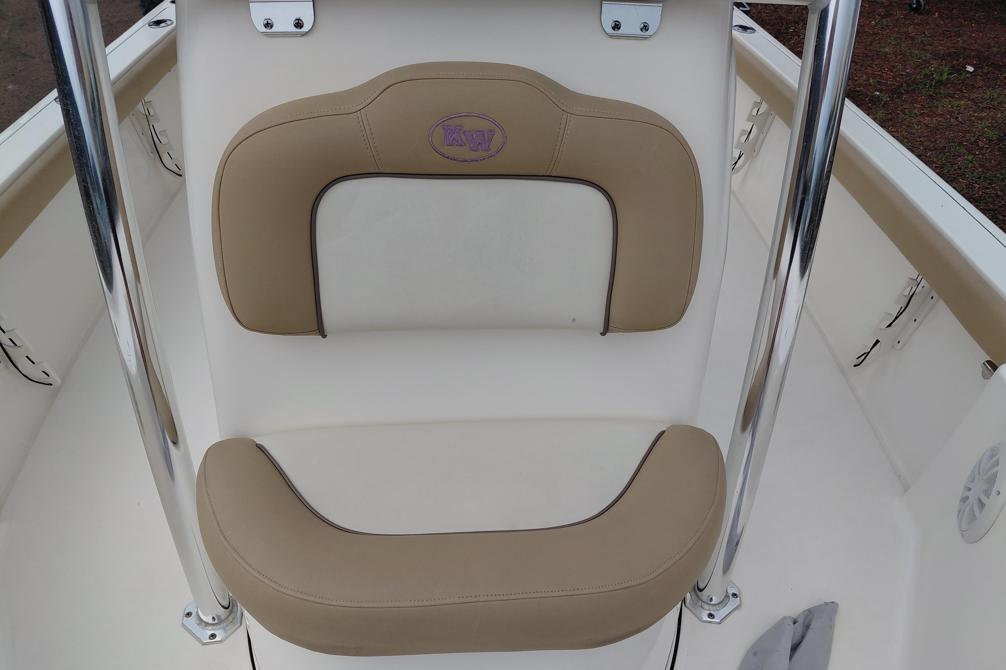 2018 Key West 230 Bay Reef boat seat with beige cushions and chrome accents.