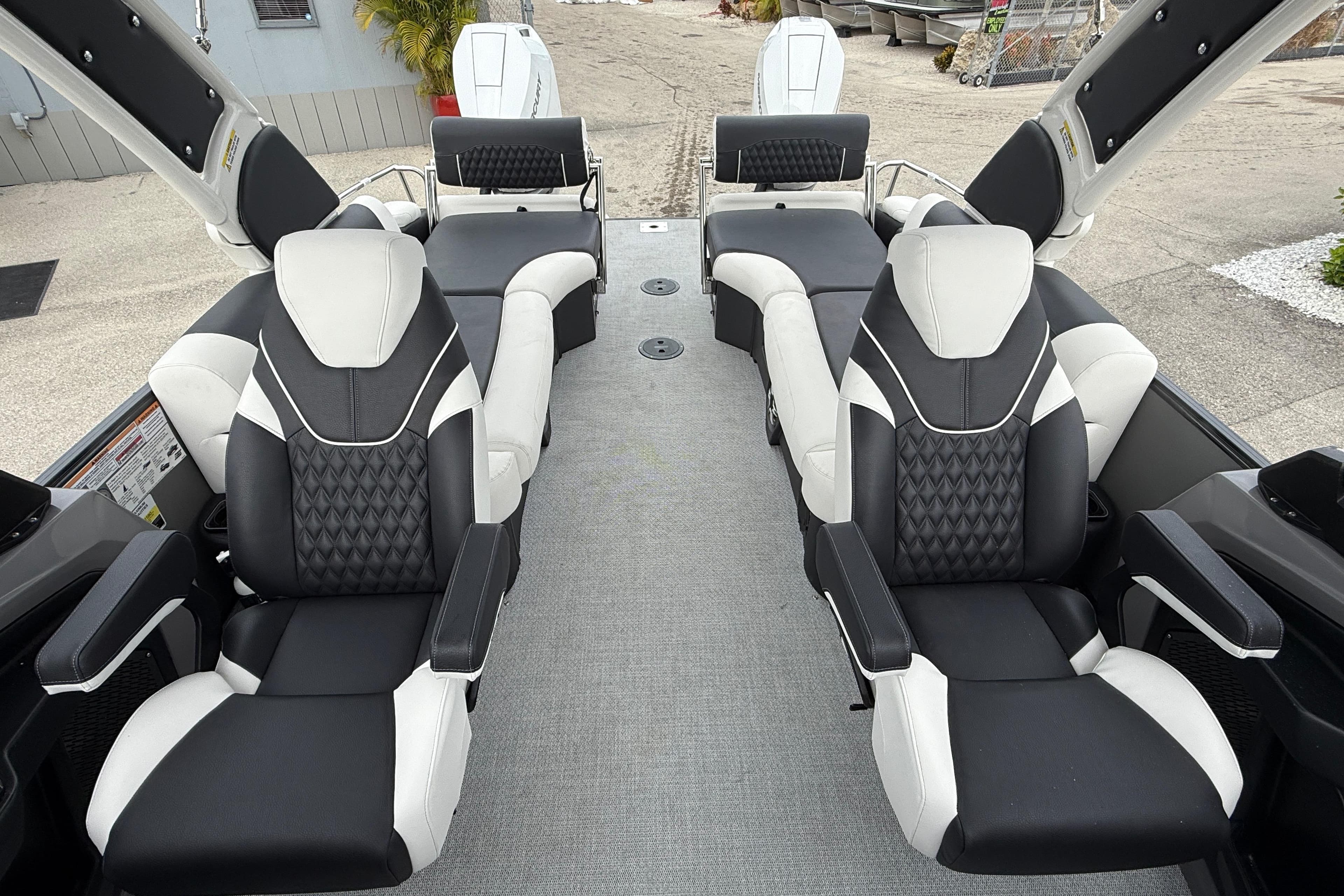 Luxurious seating on 2026 Avalon 2785 Excalibur LTD Windshield Quad Lounger boat.
