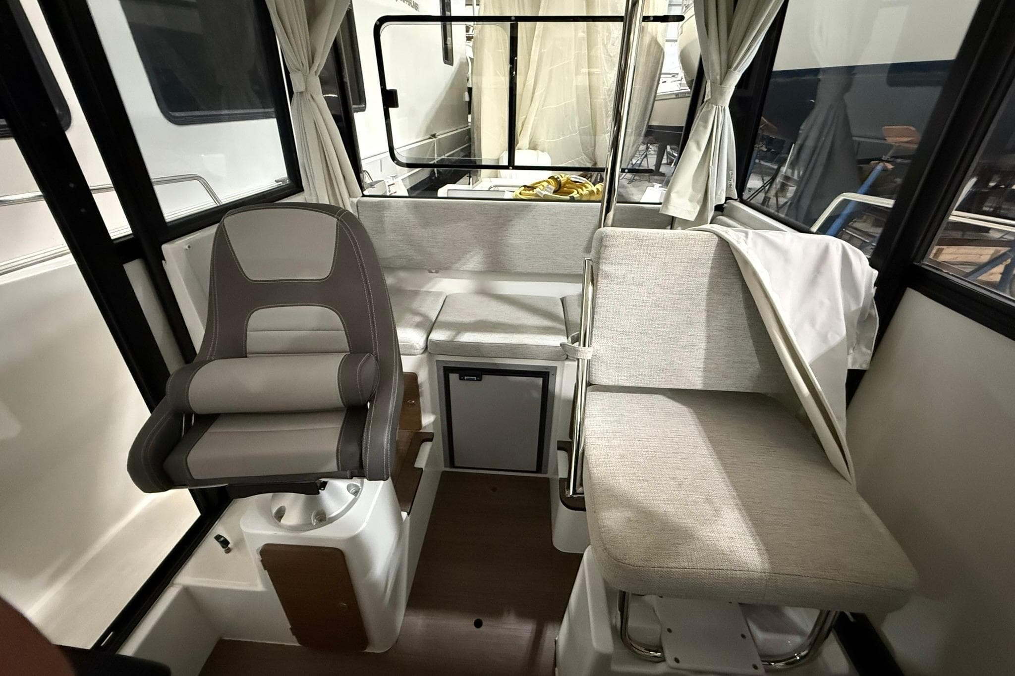 2024 Jeanneau NC Sport 795 Series 2 interior with seating and helm station.