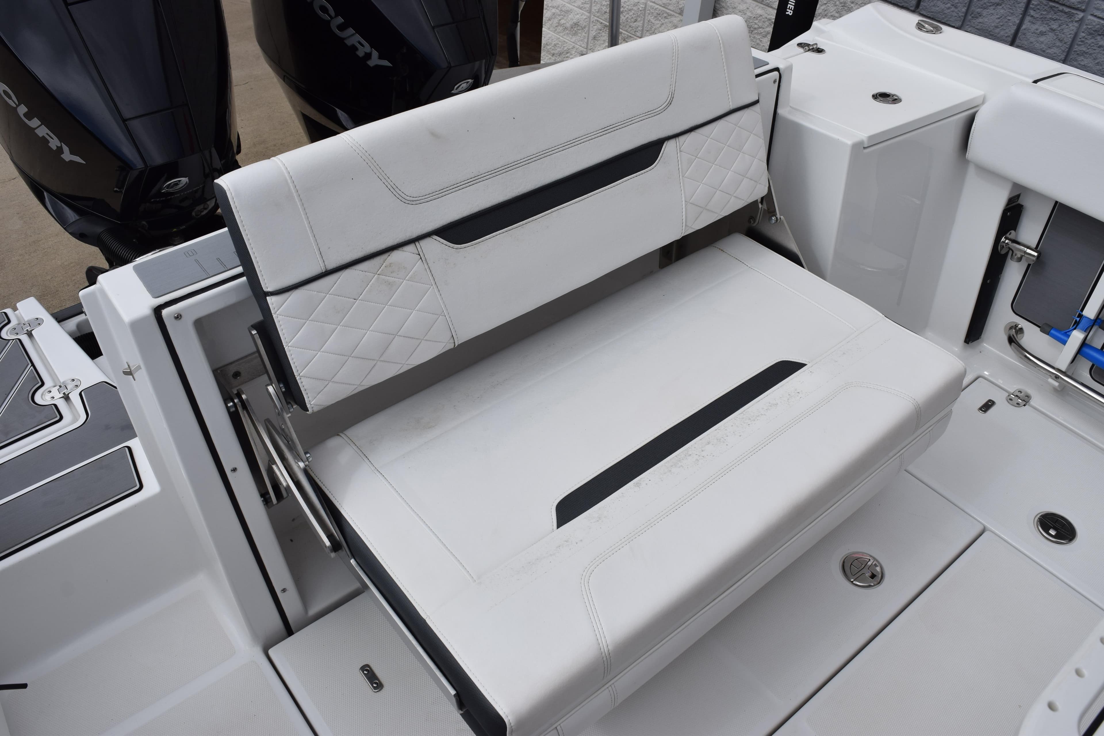 2023 Blackfin 252 CC boat seating area with dual Mercury engines.