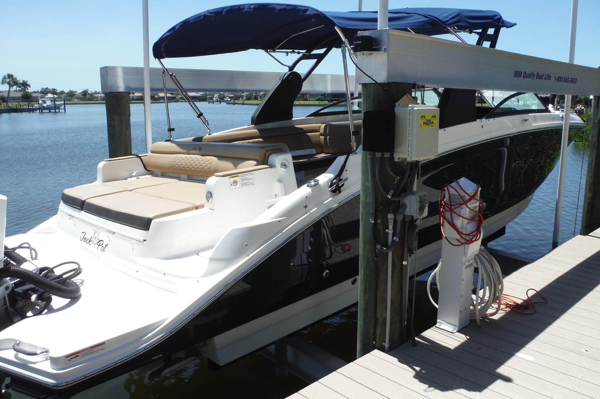 2019 Sea Ray SDX 290 Outboard docked, featuring sleek design and spacious seating.
