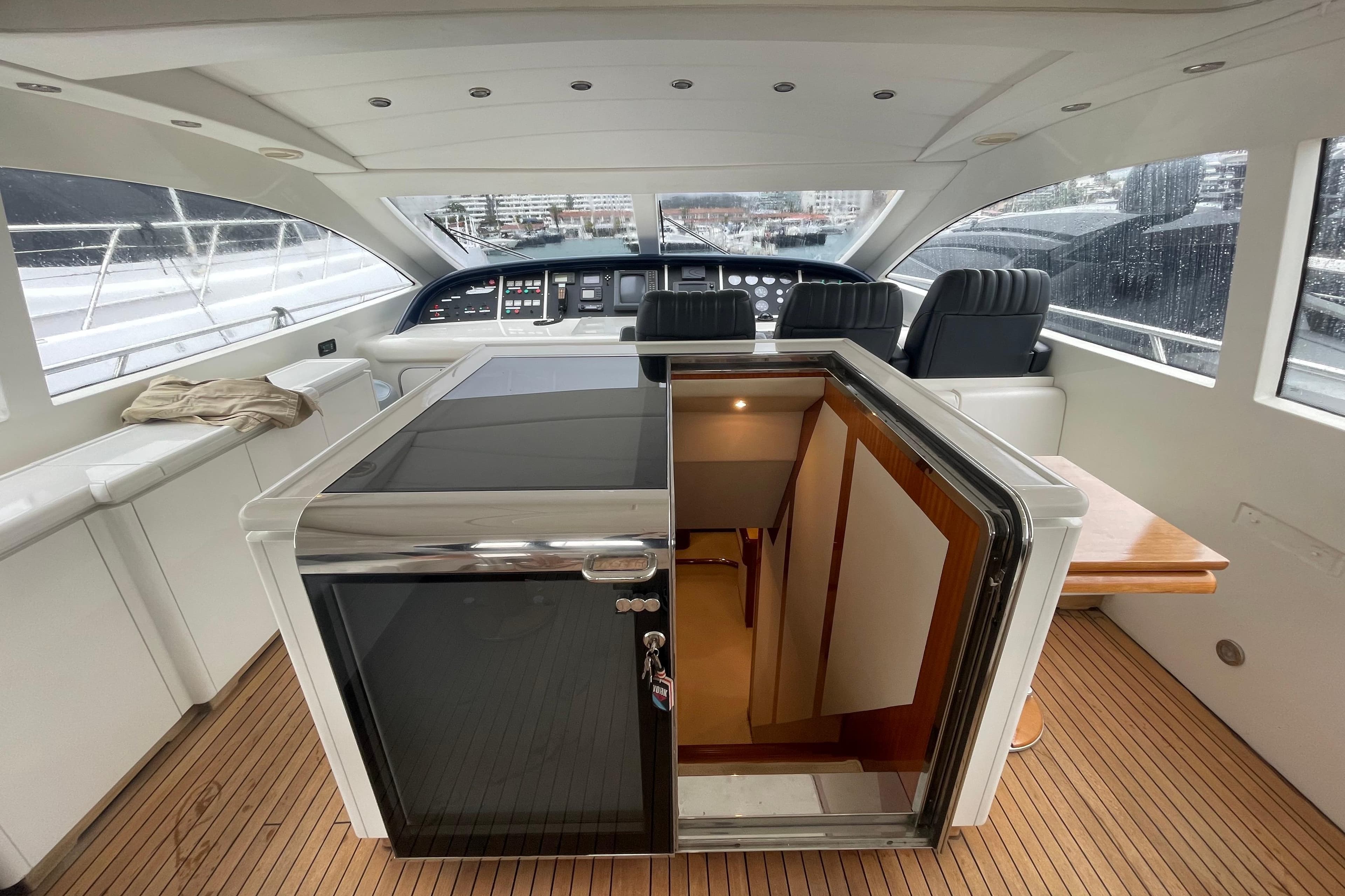 Luxurious 1999 Mangusta 72 yacht interior with sleek design and modern amenities.
