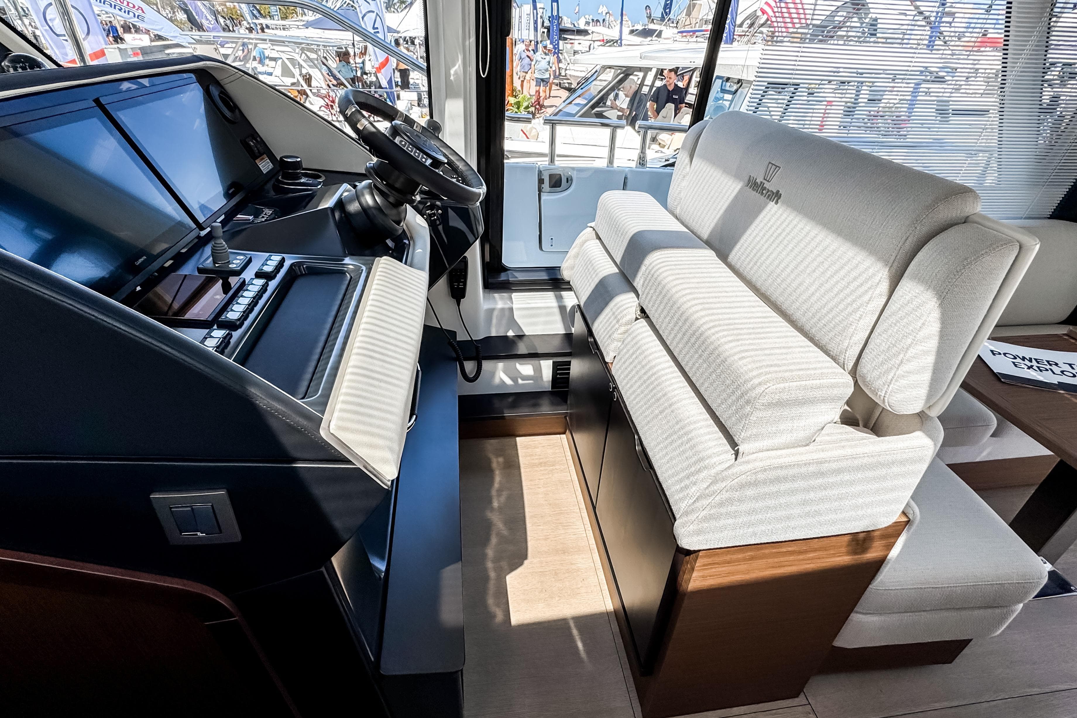 Interior of 2026 Wellcraft 44 Explorer with helm console and seating.