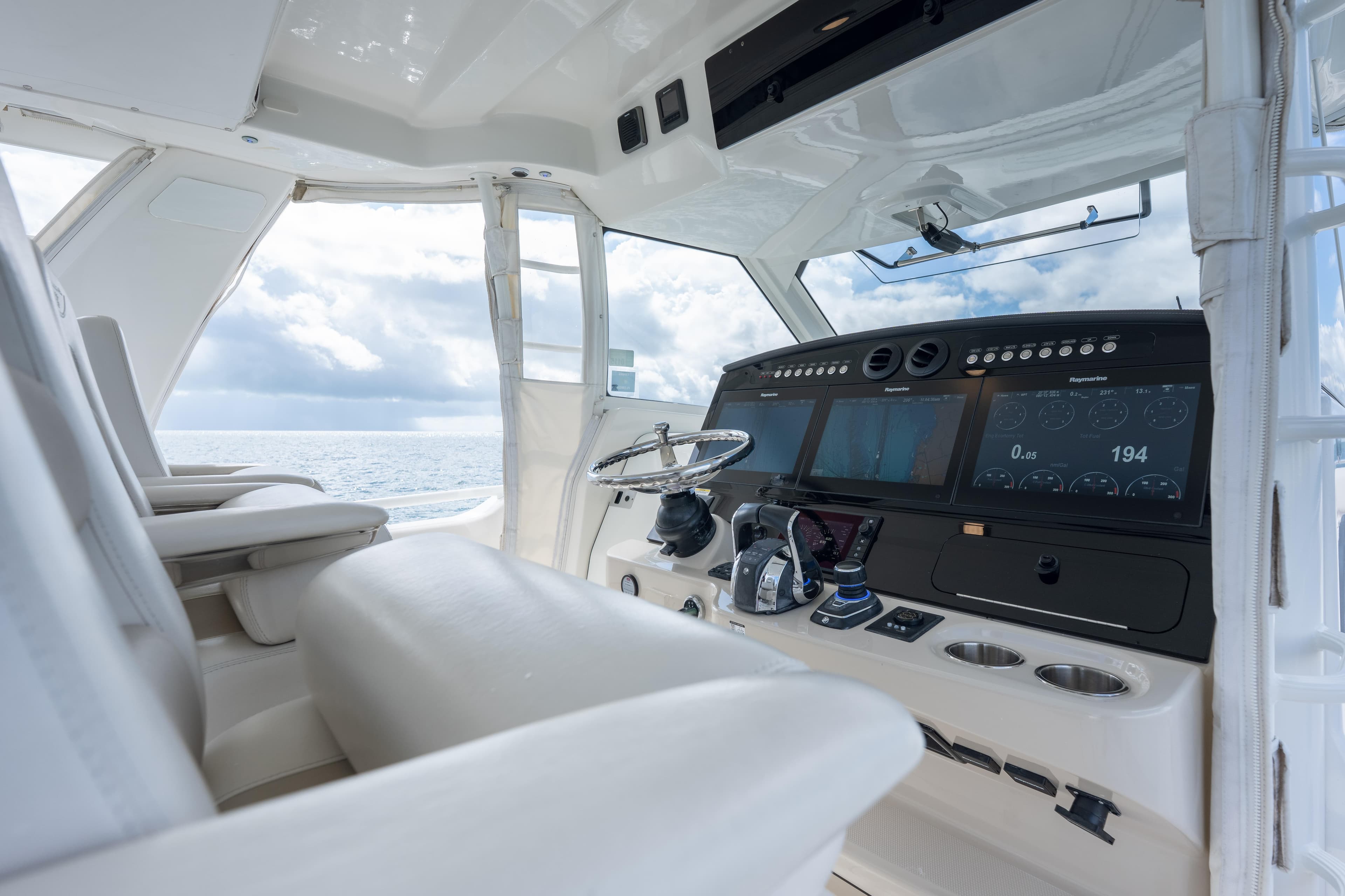 2018 Boston Whaler 420 Outrage helm with advanced navigation displays and luxurious seating.
