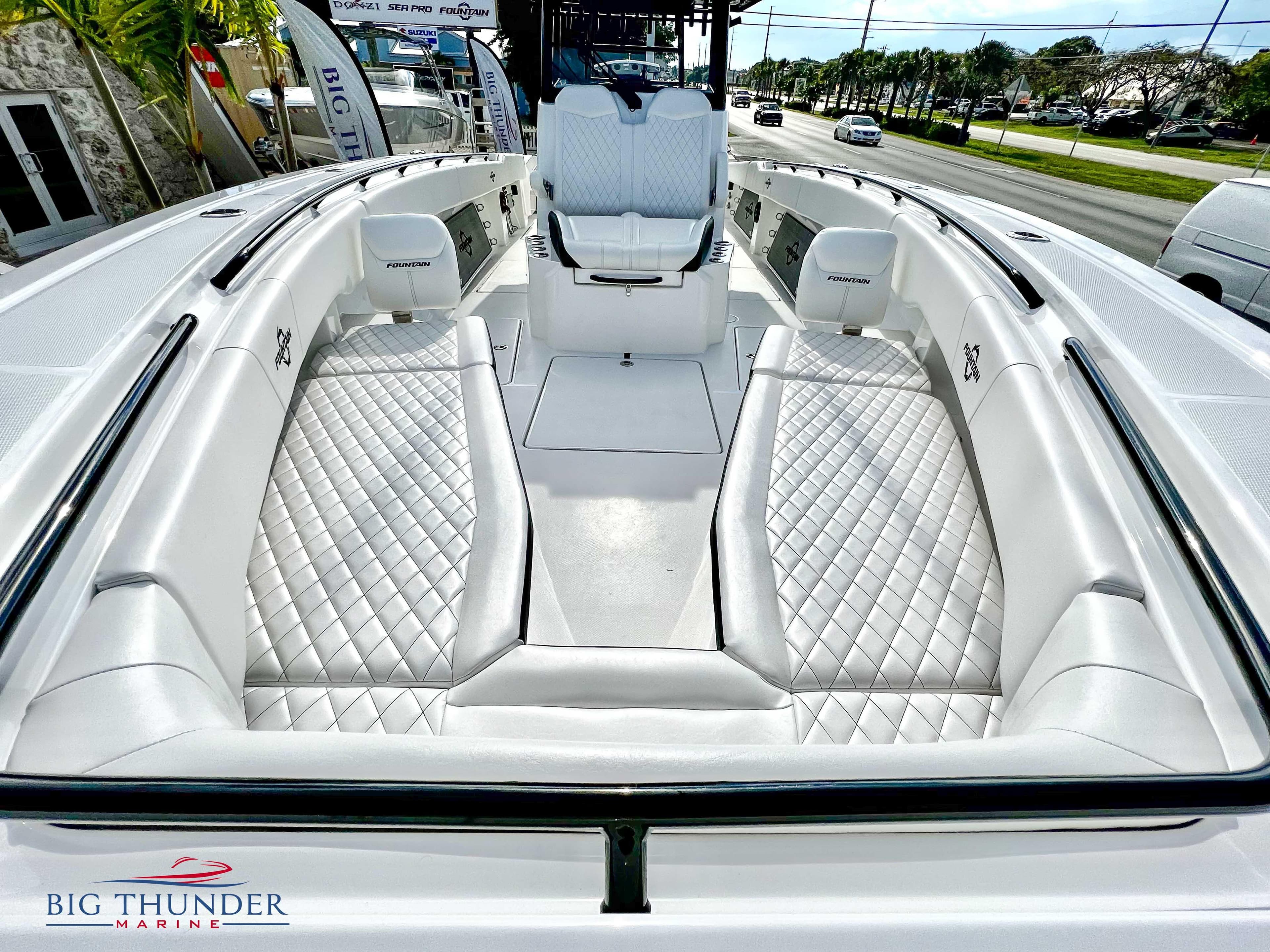 2023 Fountain 38 TE boat with luxurious white seating and diamond stitching.
