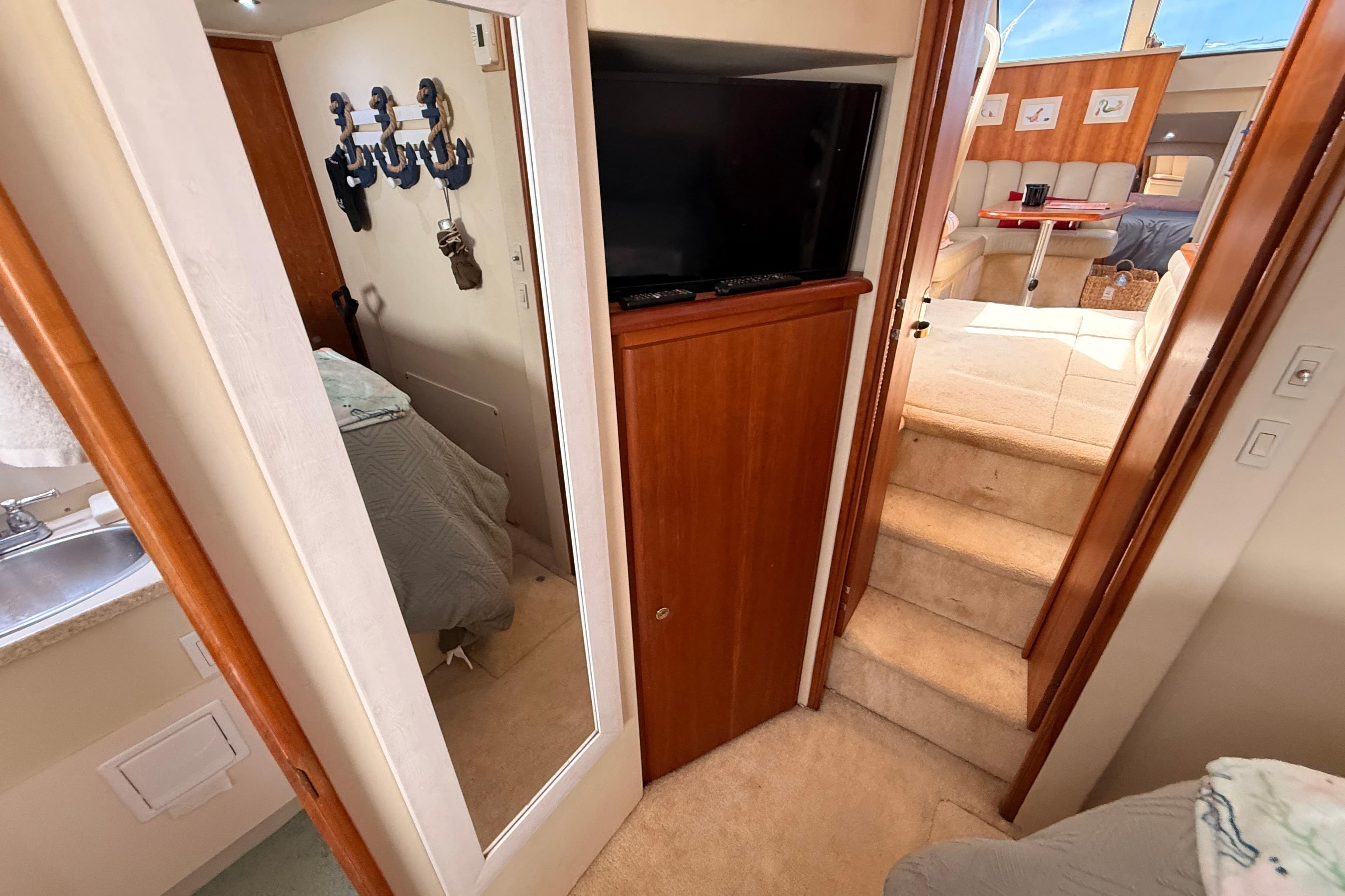 Interior of 1998 Silverton 40 Convertible yacht with cozy living space and wooden accents.