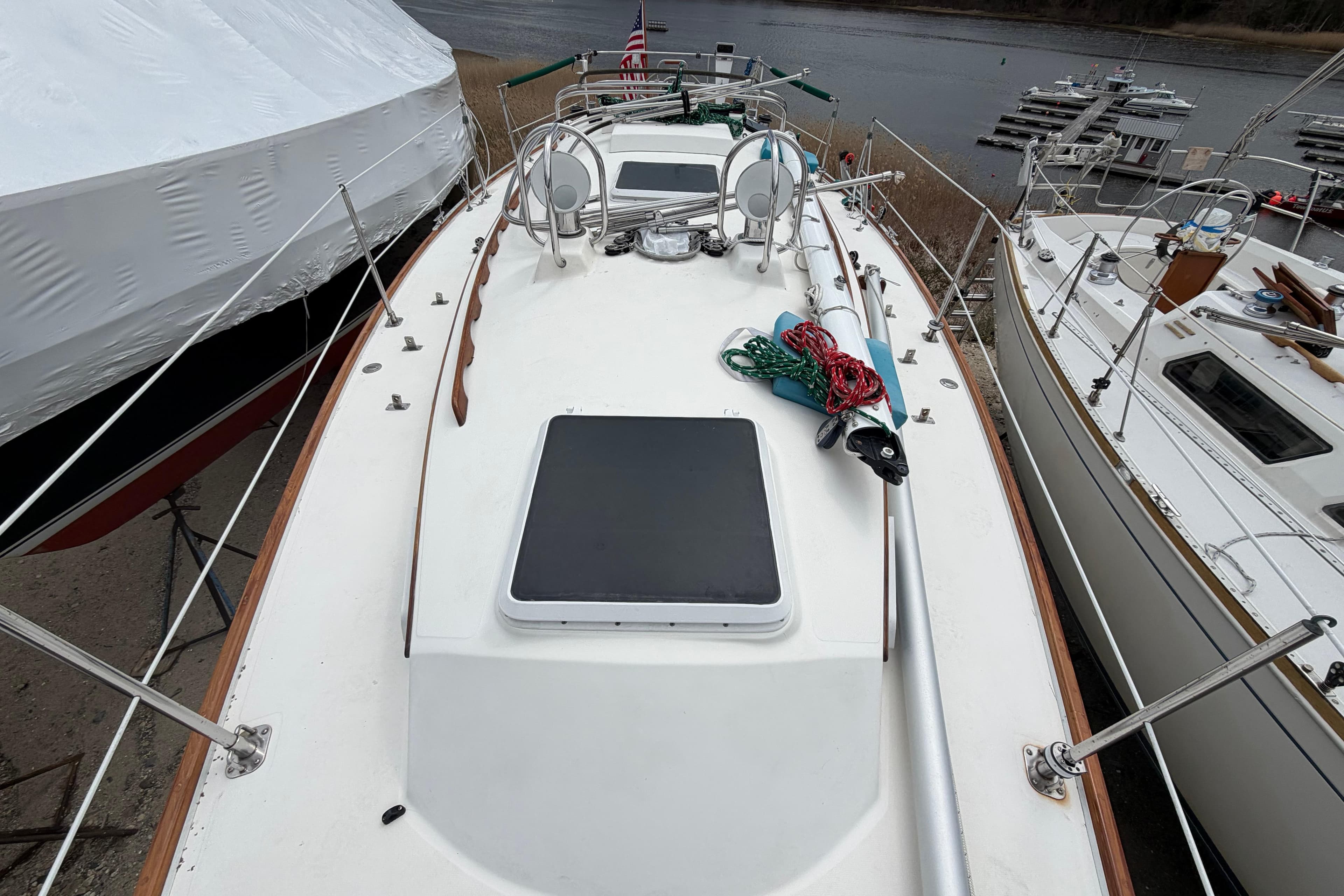 1982 Sabre 34 sailboat deck with ropes, docked near water.
