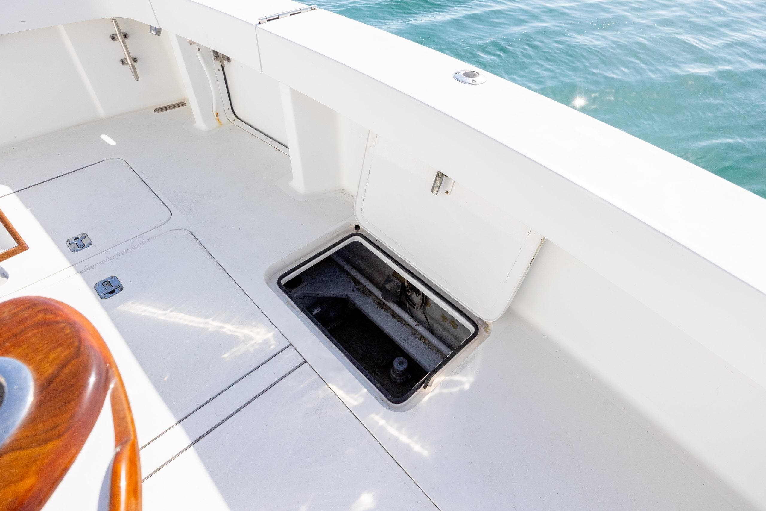 Open hatch on 2000 Viking 55 Convertible yacht deck, overlooking water.