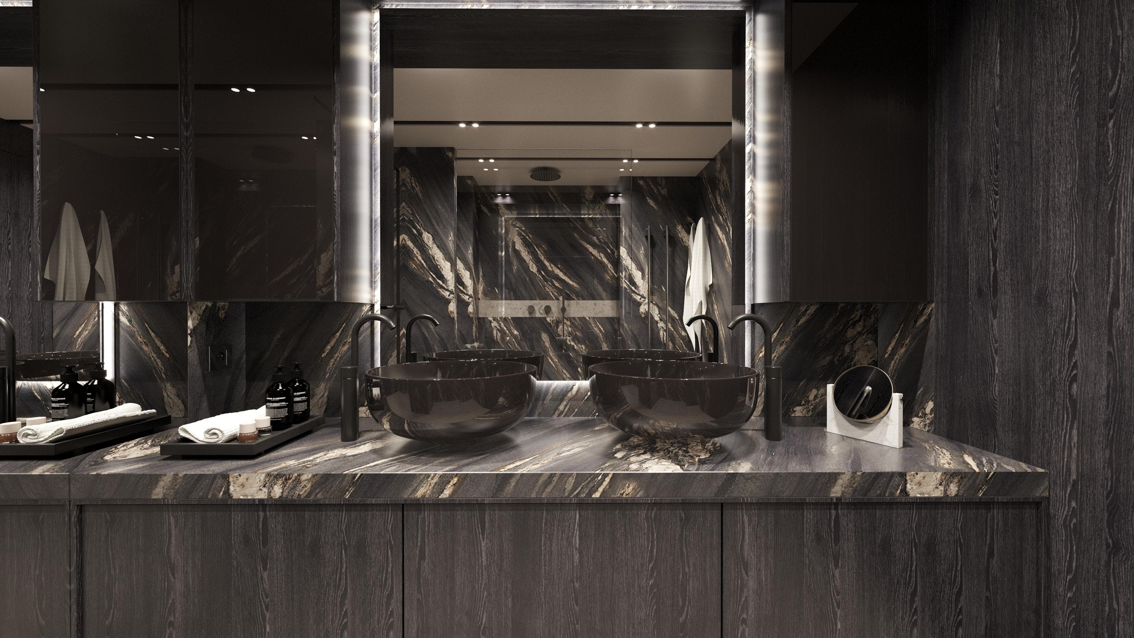 Luxurious bathroom with dual sinks, dark marble countertops, and modern fixtures on Moon 100 Sail yacht.