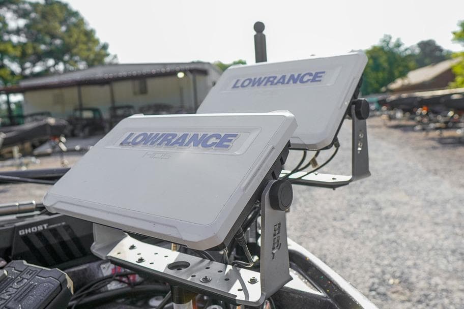 Lowrance HDS displays on a 2023 Bass Cat Puma STS boat, outdoor setting.