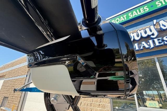 2020 Moomba Makai boat detail at dealership, showcasing sleek black and white design.