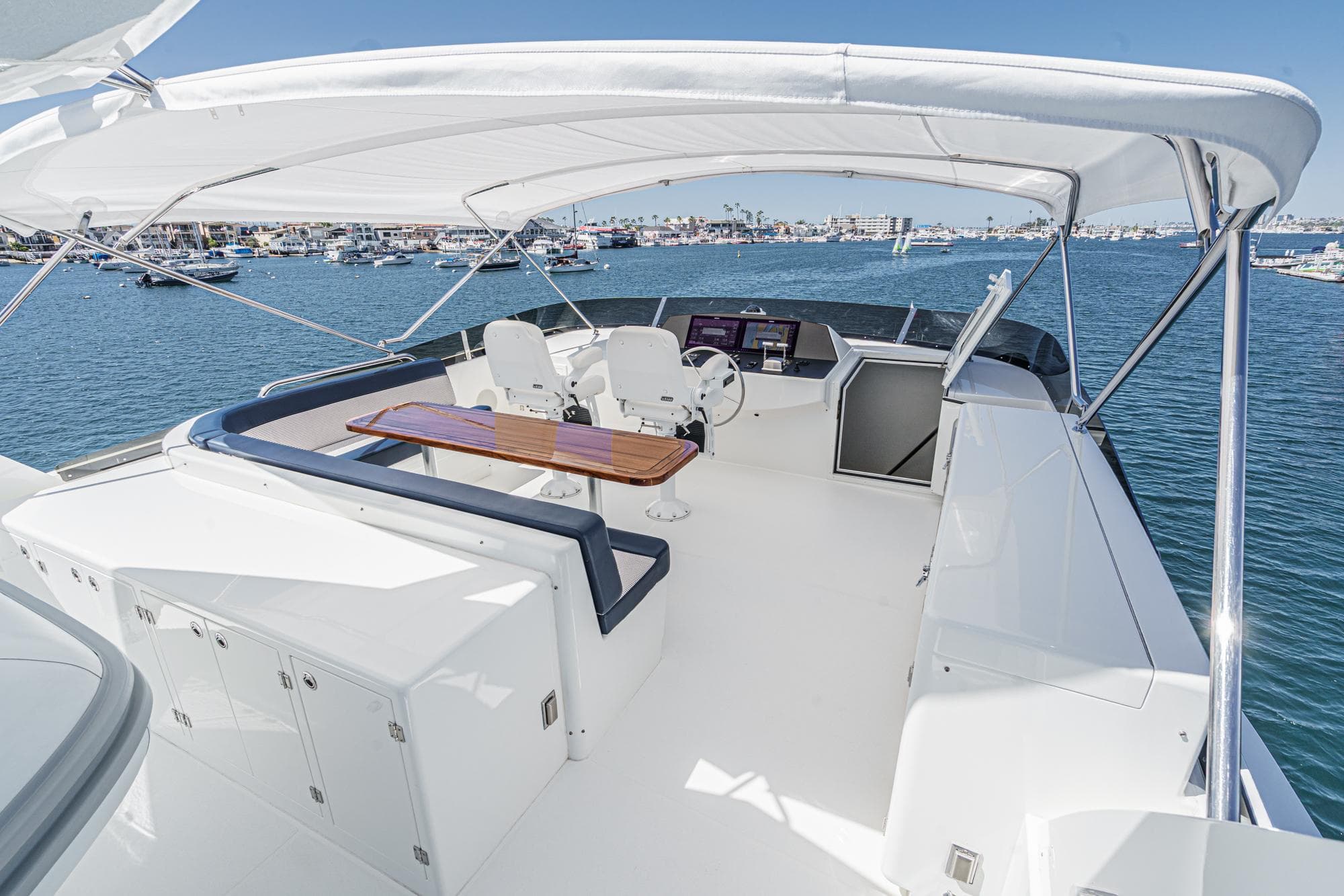 Luxurious Northcoast Yachts Raised Pilothouse 1999/2024 with spacious deck and seating area.