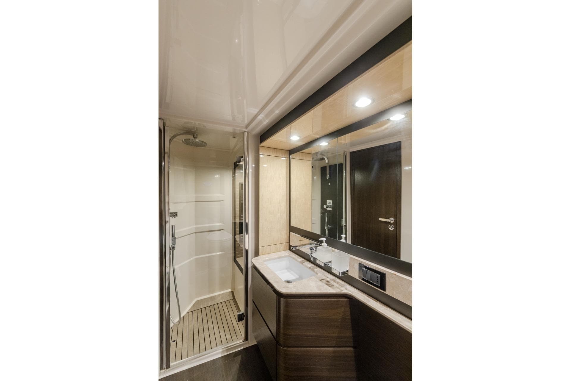 Luxurious bathroom in 2019 Azimut 66 yacht, featuring modern fixtures and elegant design.