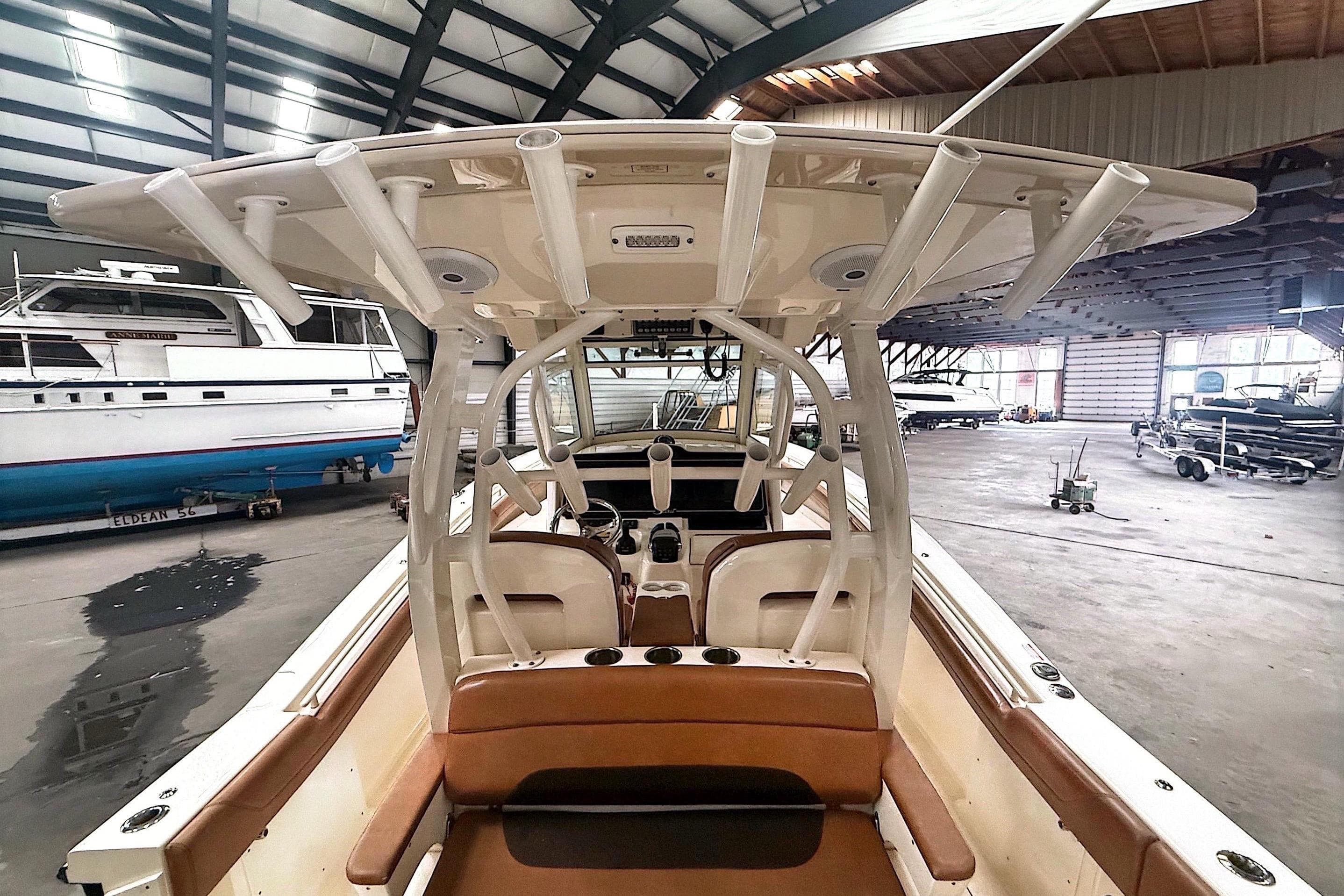 2016 Scout 350 LXF boat interior in a spacious indoor marina setting.