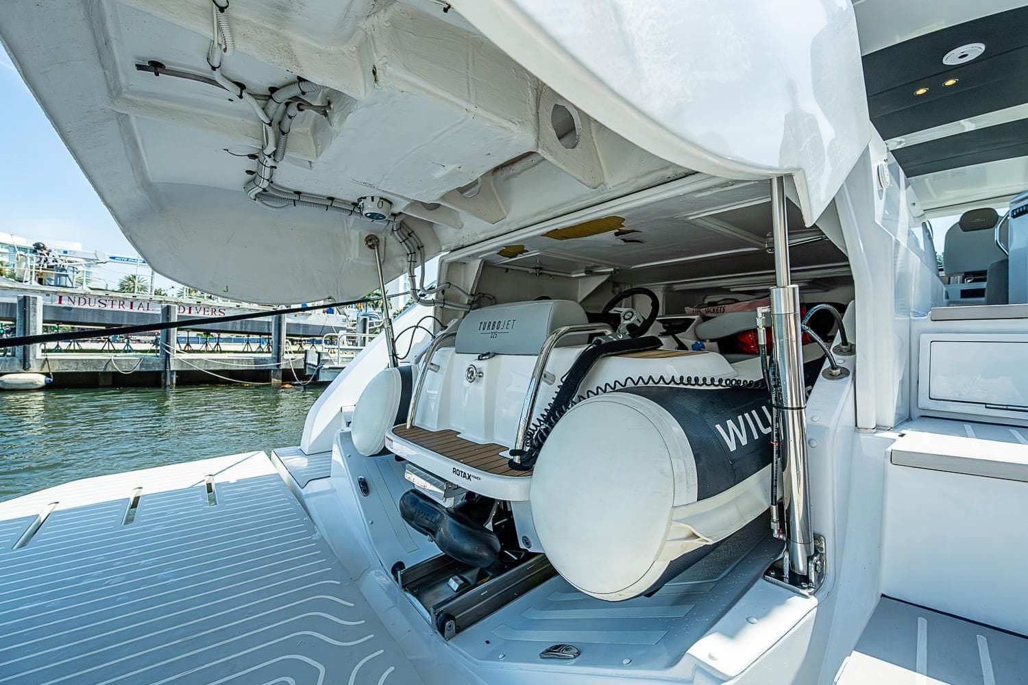 2019 Azimut Atlantis 51 yacht with open garage and stored watercraft.