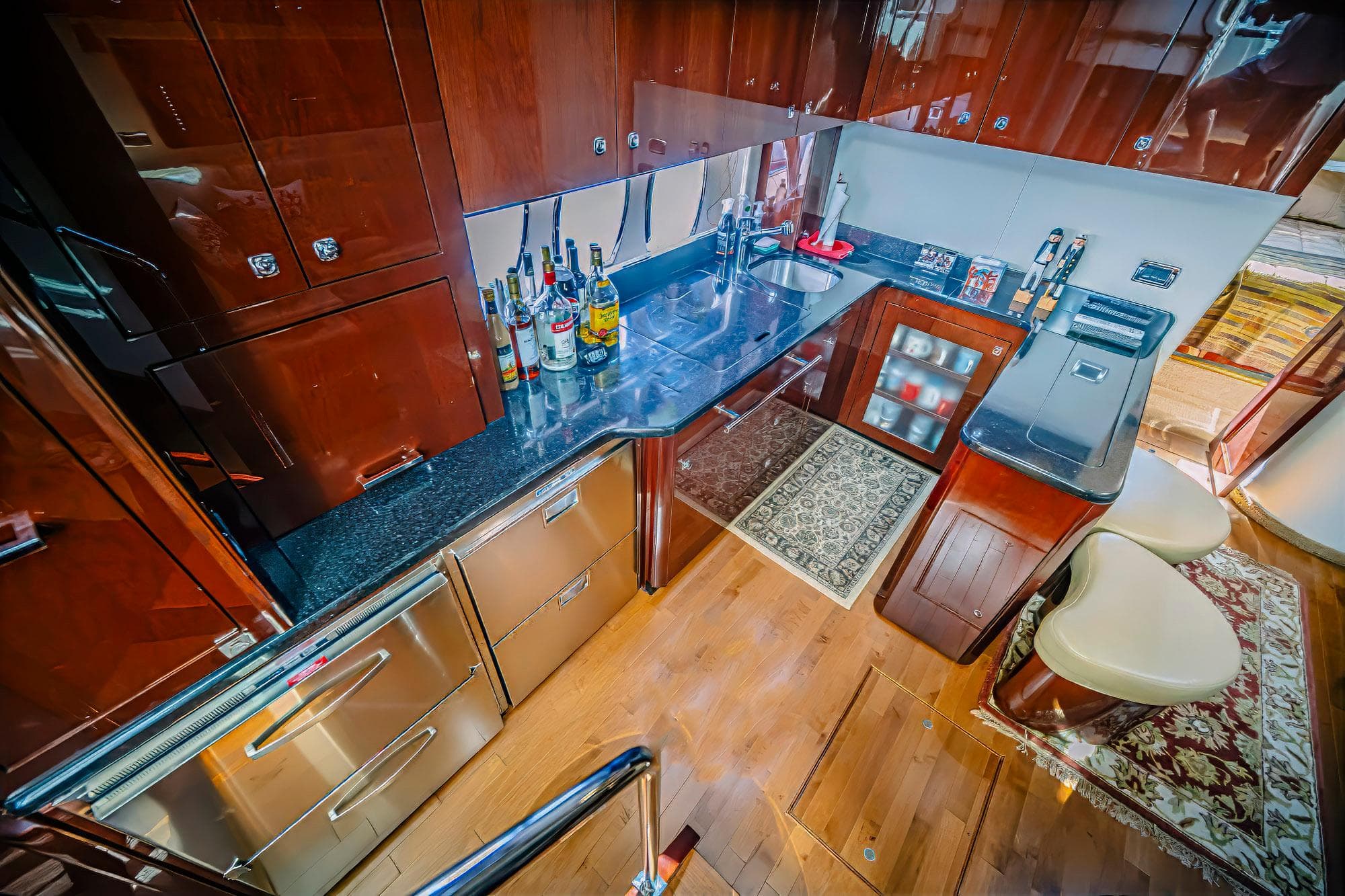 Luxurious 2011 Sea Ray 580 Sundancer yacht kitchen with modern amenities and elegant wood finishes.