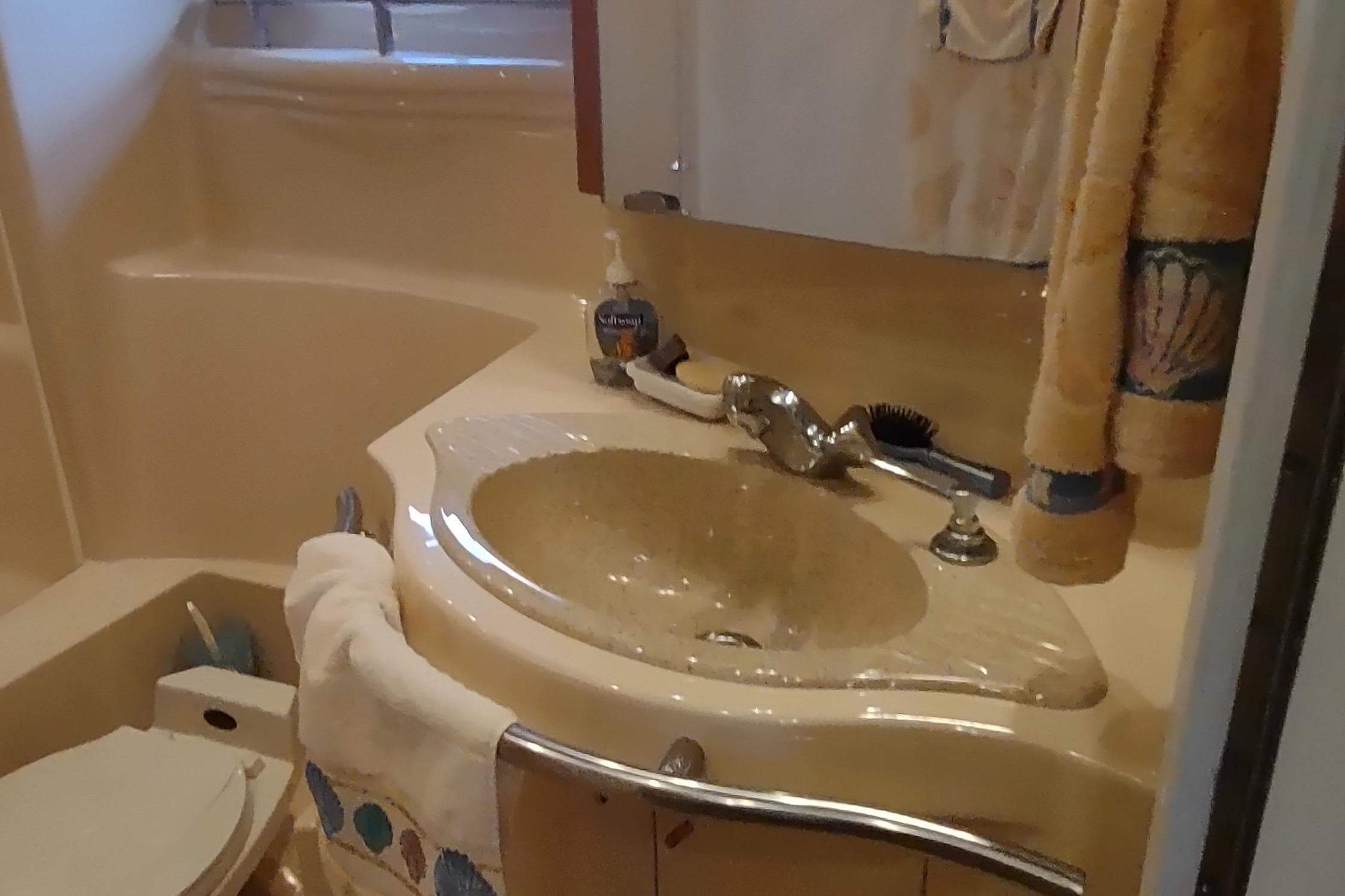 Bathroom interior of 2001 Maxum 4600 SCB yacht with sink and toiletries.