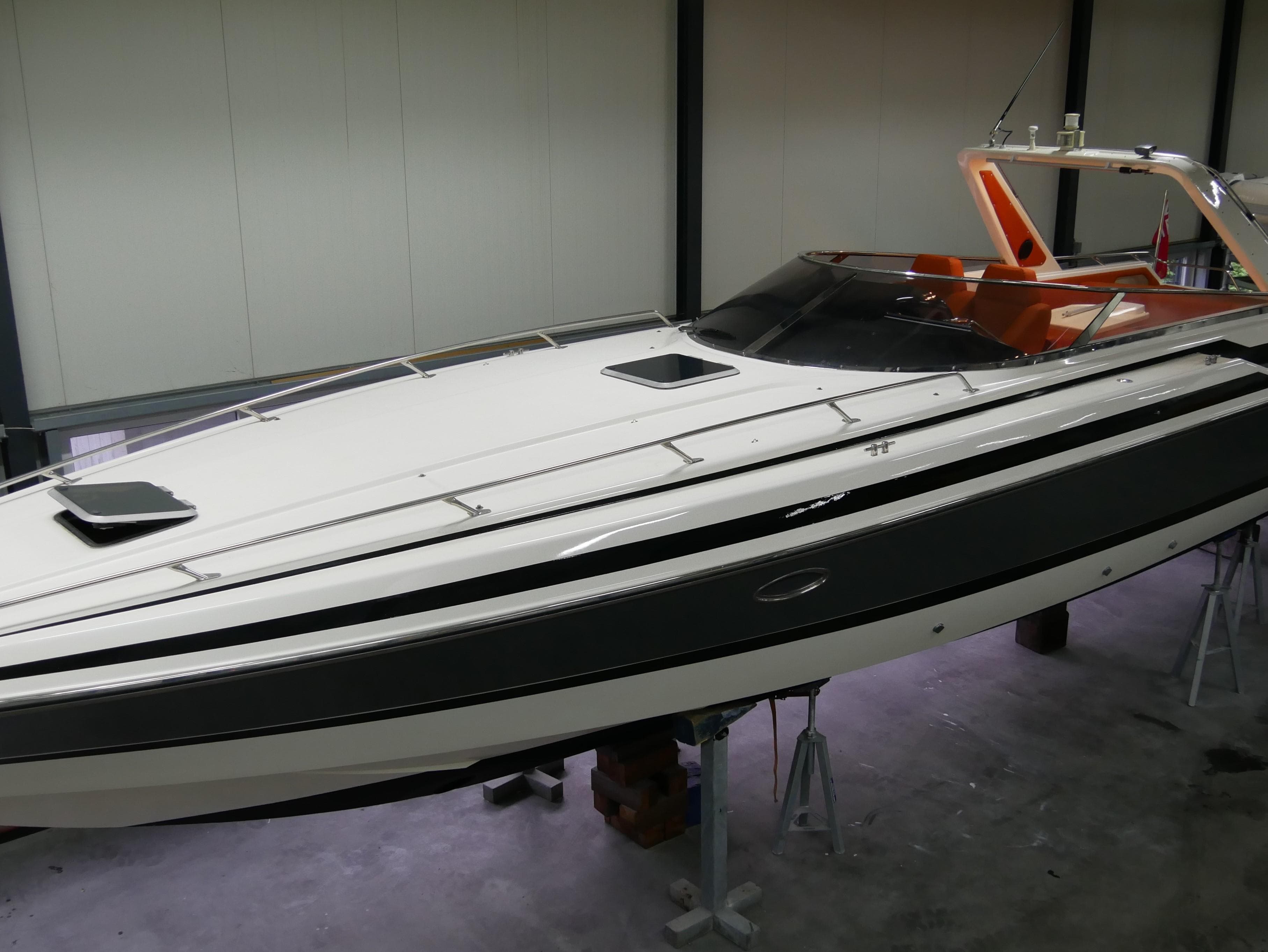 1991 Sunseeker Thunderhawk 43 boat in a storage facility, side view.