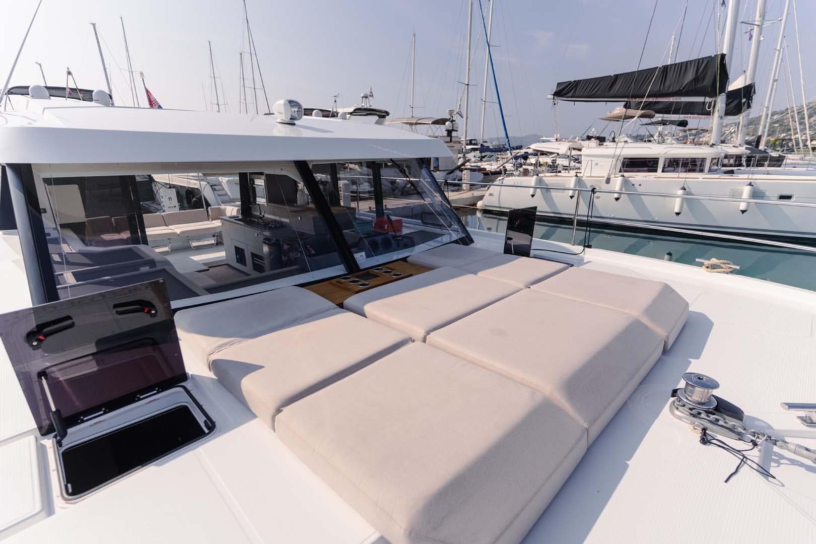 2022 Fountaine Pajot MY4.S yacht with spacious deck and modern design in marina.